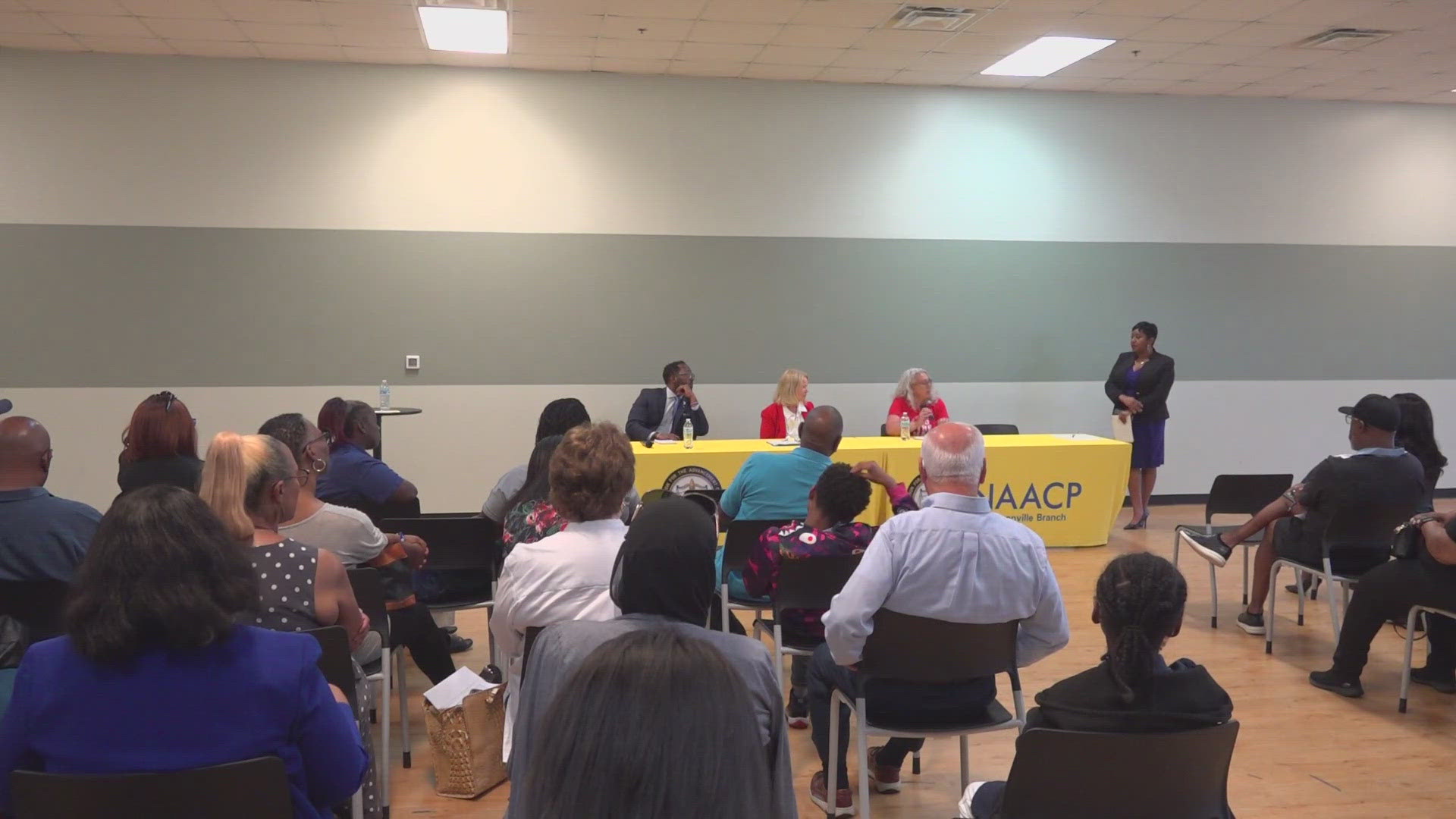 School board chair Darryl Willie and superintendent Dr. Dana Kriznar spoke to parents, teachers, and NAACP members about why the district needs to consolidate.