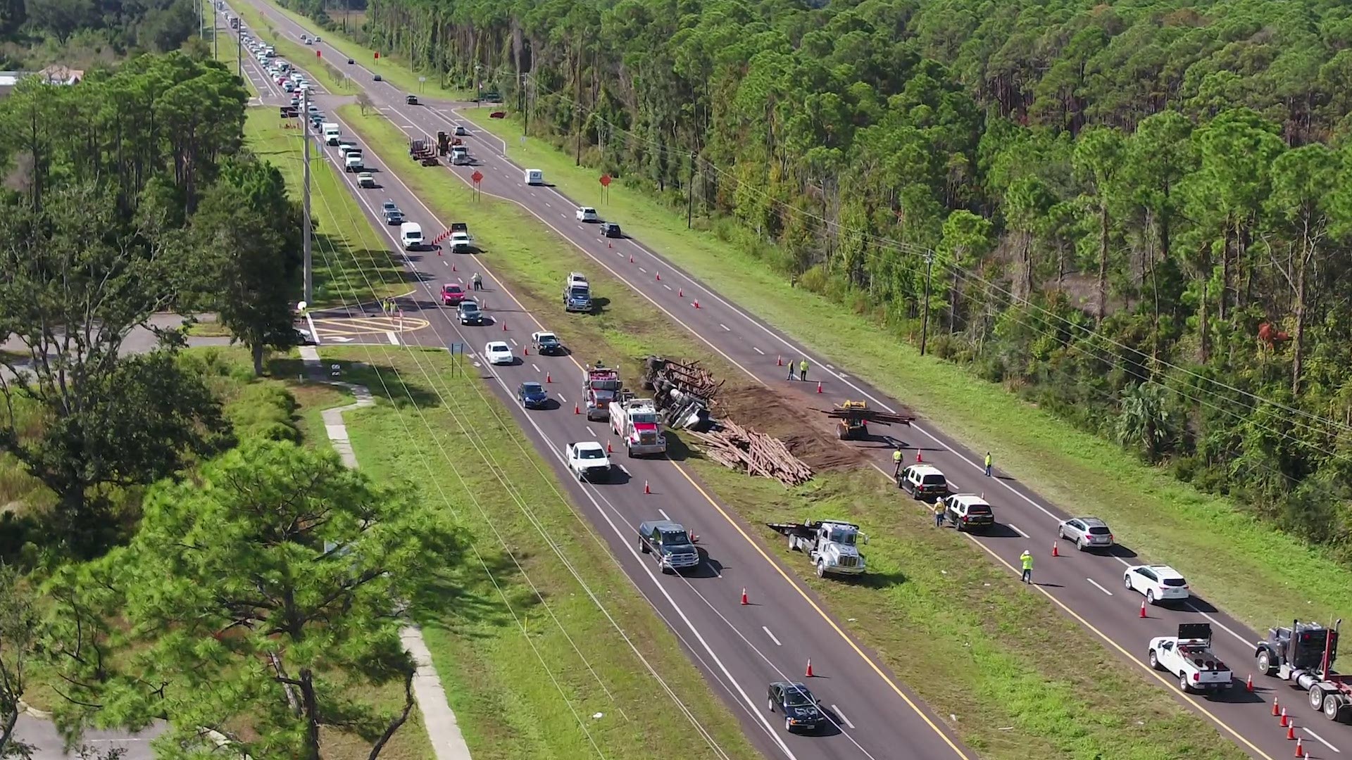 A 66-year-old man has died after a log truck and vehicle collided in Nassau County Tuesday morning, according to the Florida Highway Patrol.
