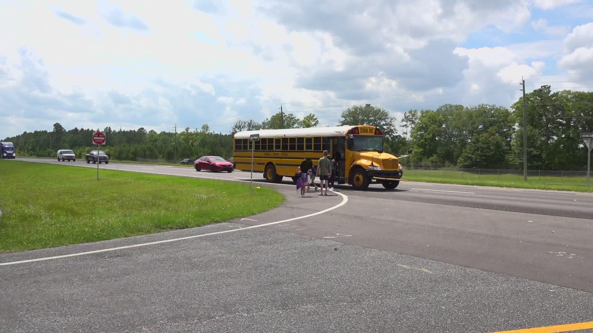 Bailey and Zach Taylor have recorded several vehicles driving past their children’s bus as it’s preparing to stop.