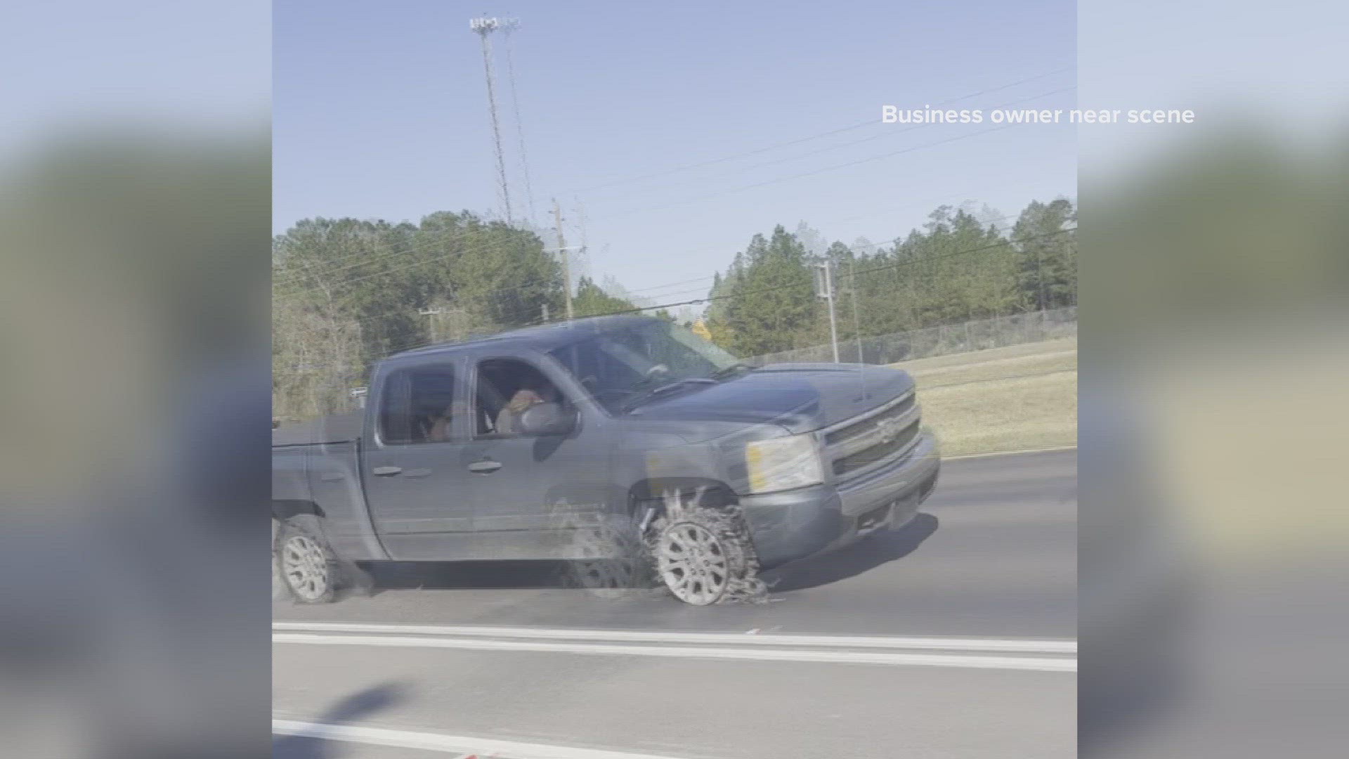 The video shows a police officer using stop sticks across State Road 200, to pierce the truck's tires.