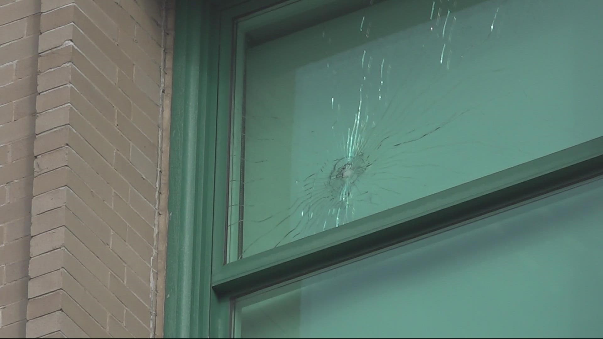 The windows of the City Hall building in Downtown Jacksonville were seen with bullet holes Tuesday.