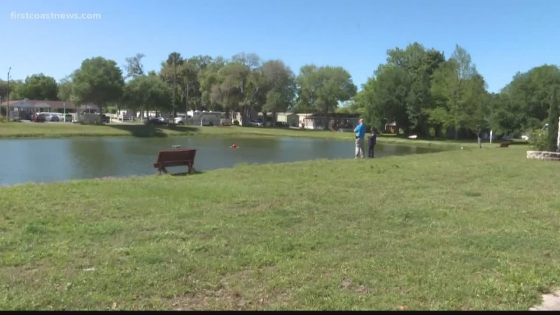 A dive team was scouring the bottom of a retention pond in Atlantic Beach on Monday afternoon.