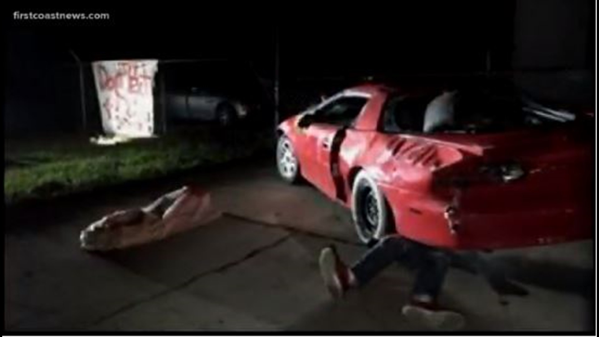 A St. Johns County man decided to use a smashed car and mannequins to send a gruesome message about texting in driving.