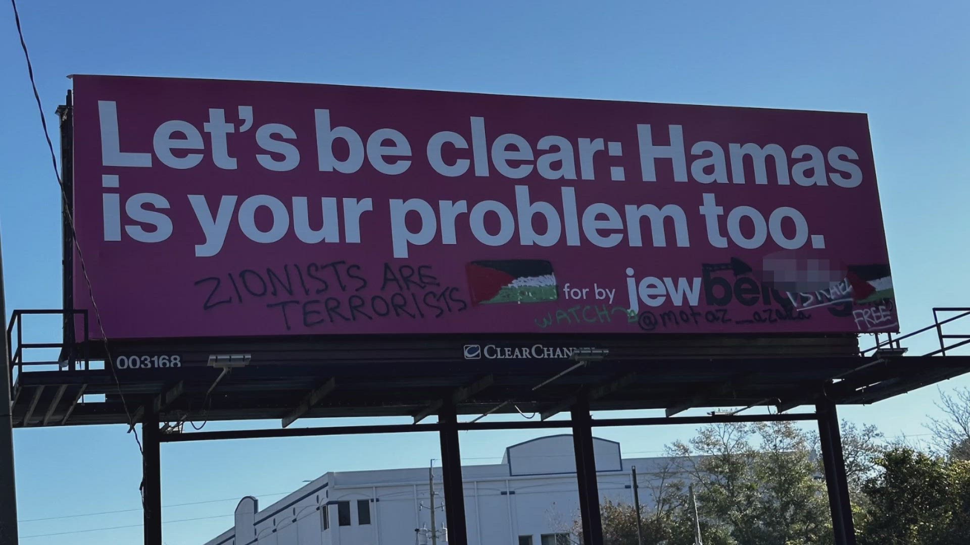 A billboard along Atlantic Blvd. has been covered up after anti-Israel and anti-Zionist messages were spray painted on it.