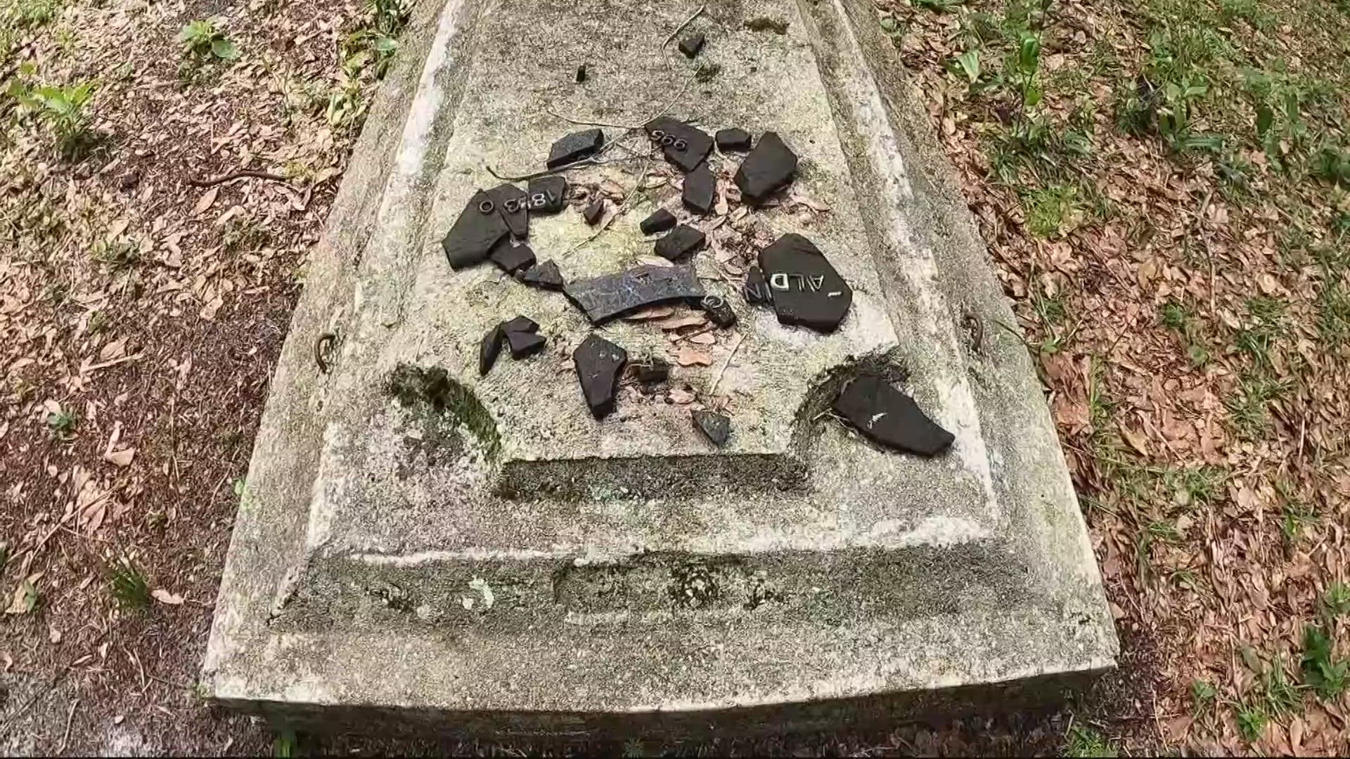 One man is working alongside others to clean up gravestones in historically Black cemeteries.