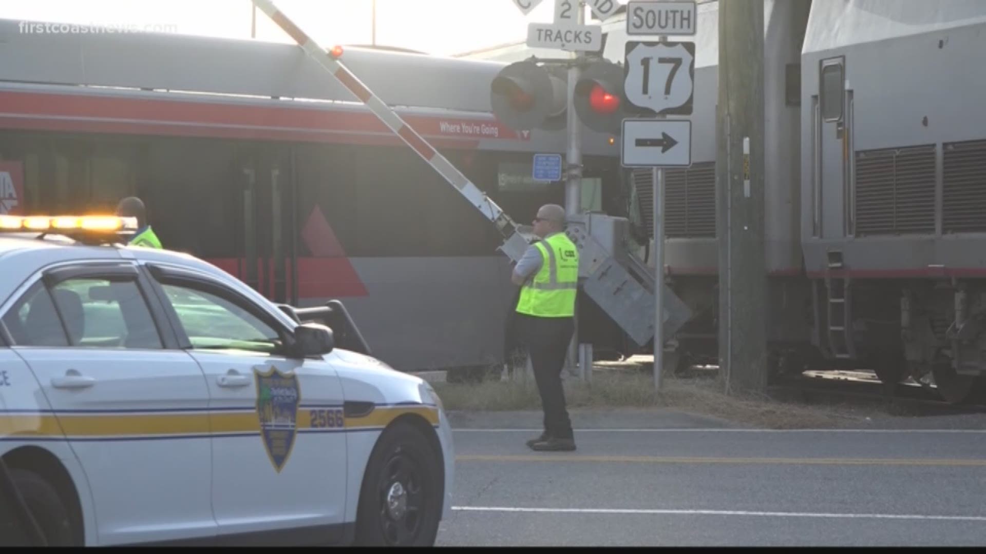 The crossing arms came down onto the bus and passengers pleaded with the driver to "back up, back up," the passenger said.