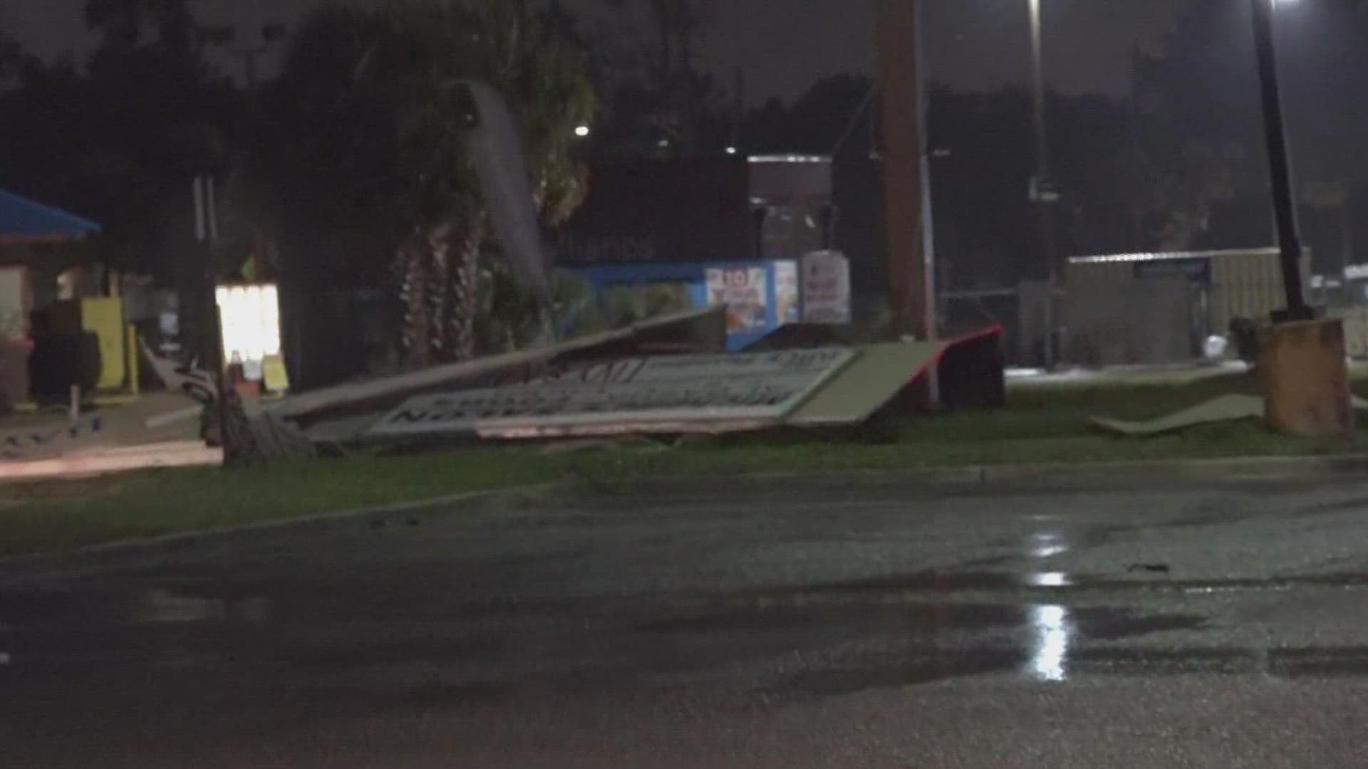 A sign fell to the ground Thursday morning during Tropical Storm Ian.