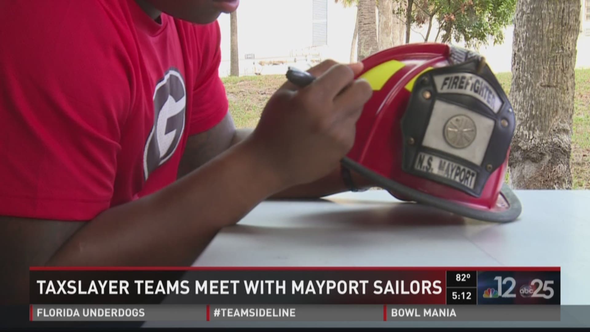 TaxSlayer Bowl teams meet with Mayport sailors