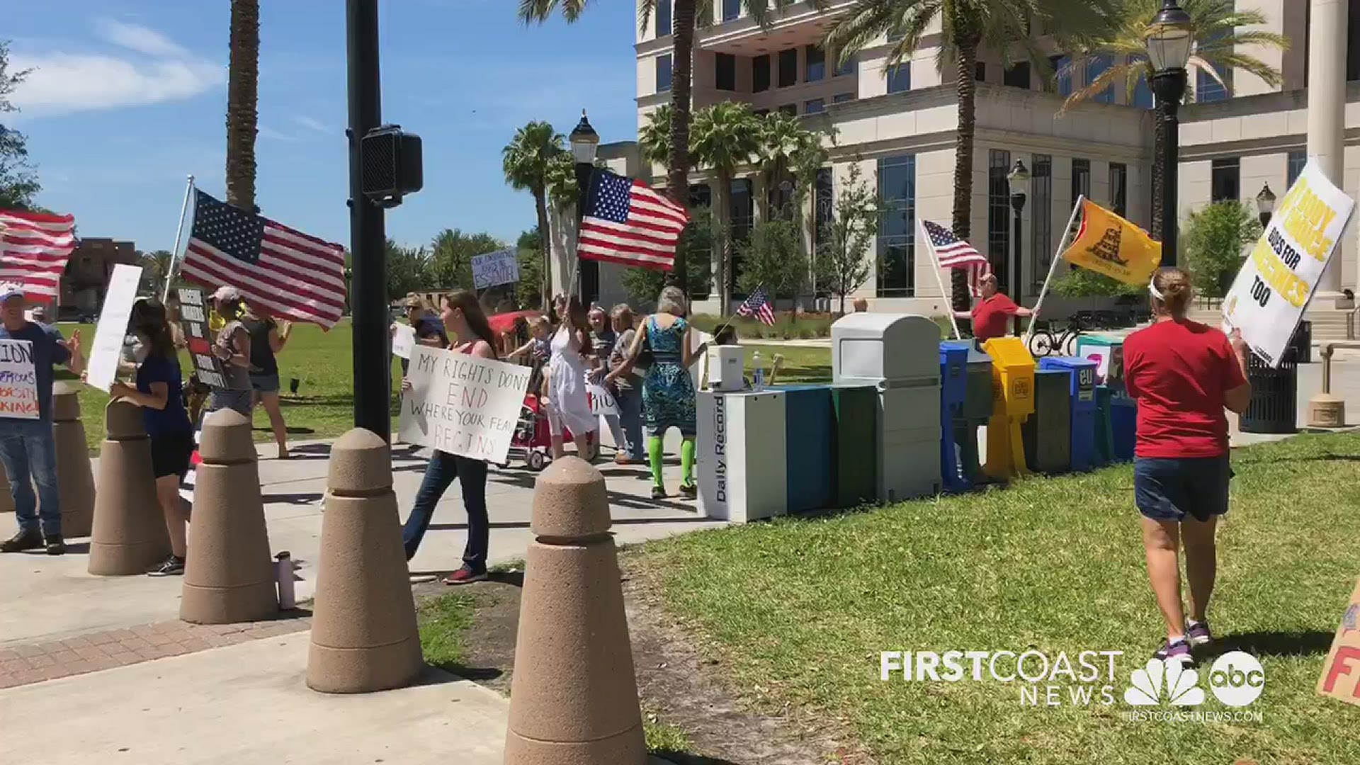 Protesters gathered outside the Duval County courthouse in Downtown Jacksonville to protest small business closures caused by COVID-19.