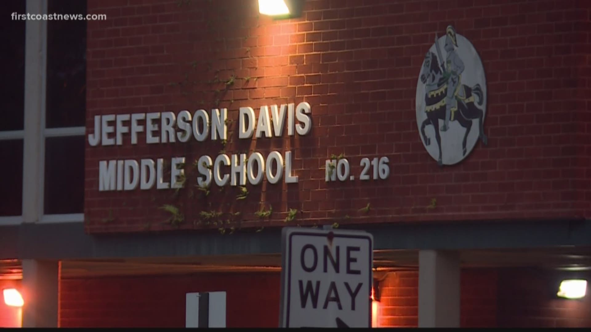 A Jacksonville Sheriff's Officer accidentally fired their weapon into the sidewalk at a middle school one the Westside while investigating a threat.