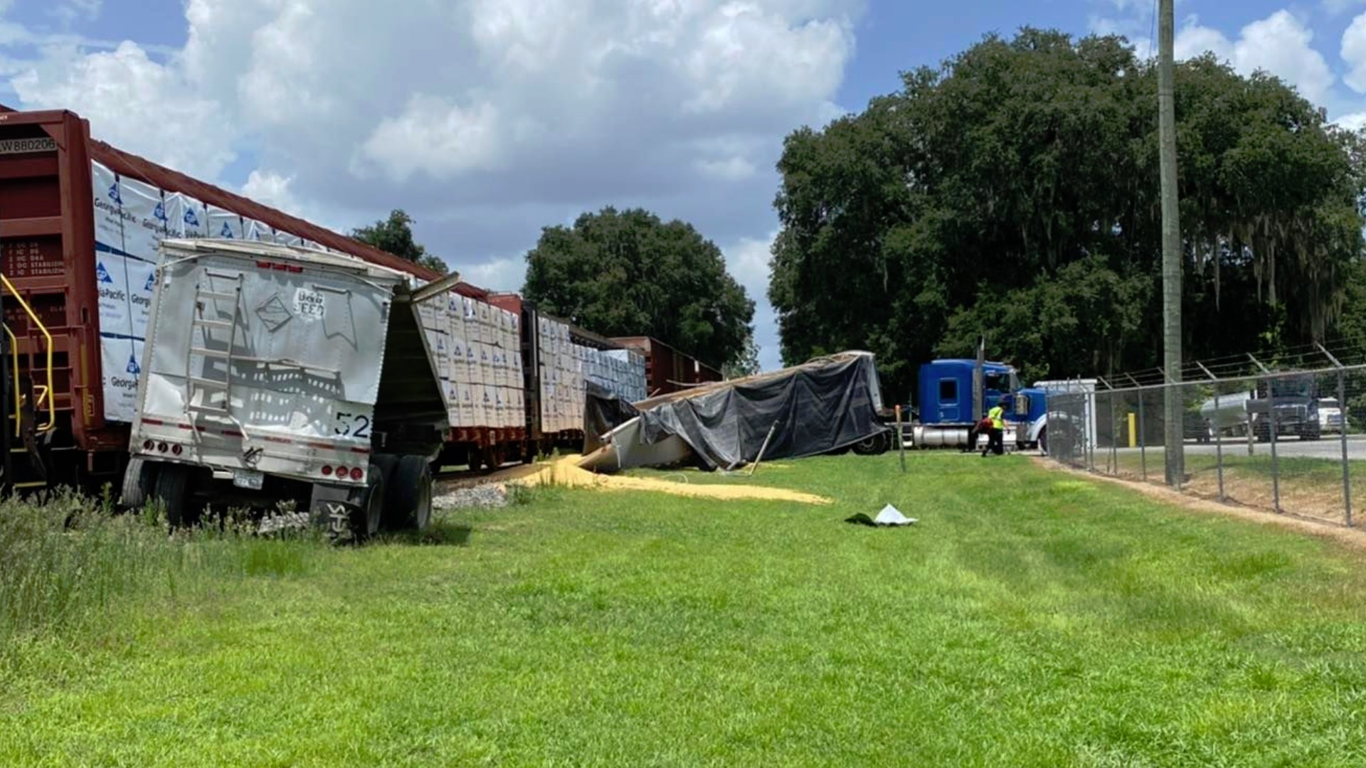 Train smashes semi truck full of feed in Live Oak
