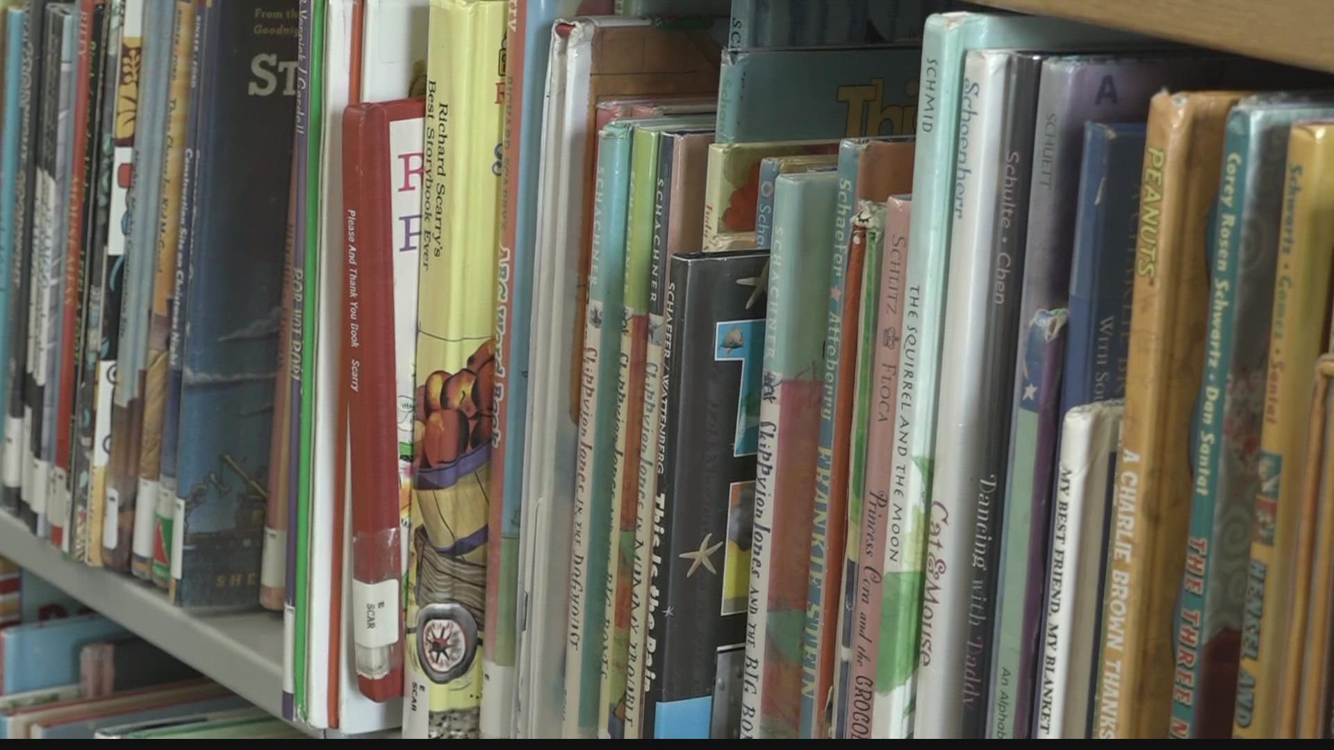 The school district says it's keeping eight book titles for student use after a parent complaint alleged the books discussed inappropriate subject matter.