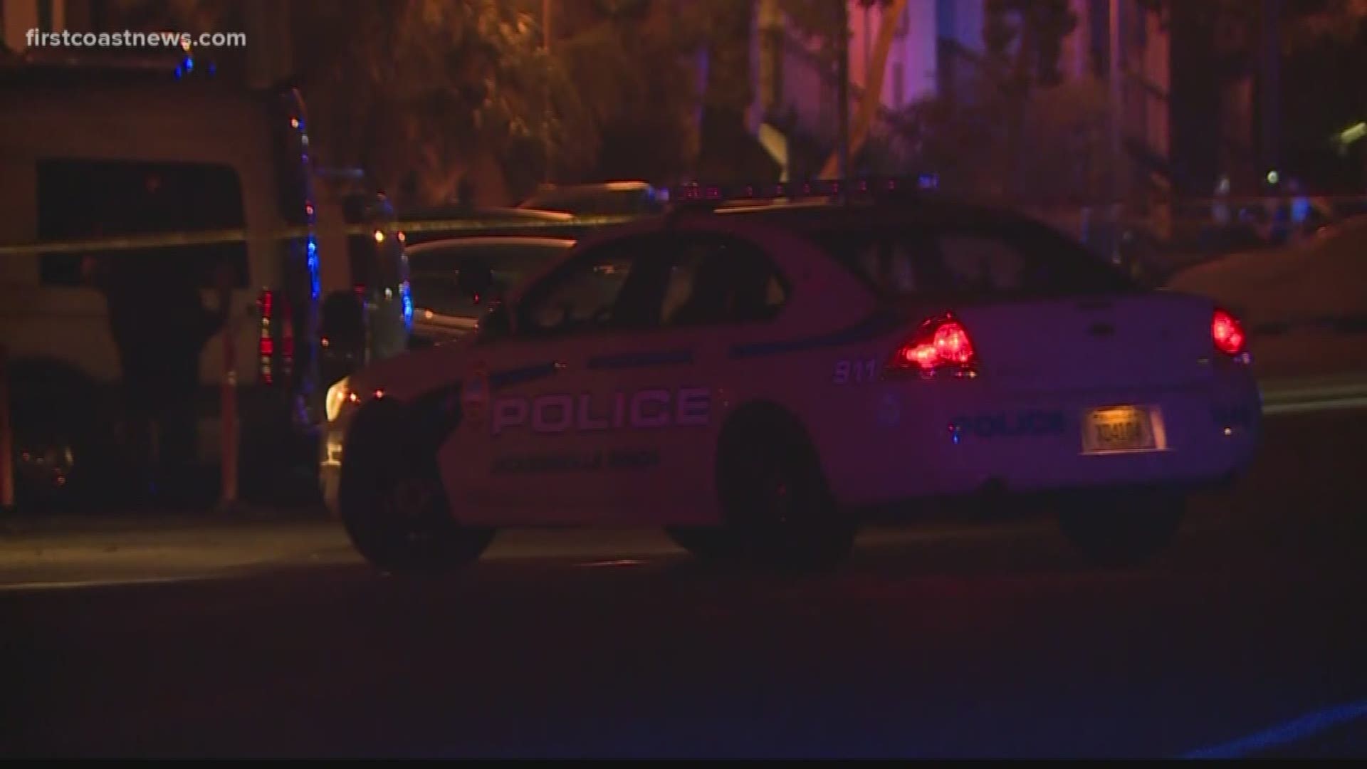 A man who lives in the apartment complex near where two men were shot overnight in Neptune Beach says one of the men shot was just taking out the trash.