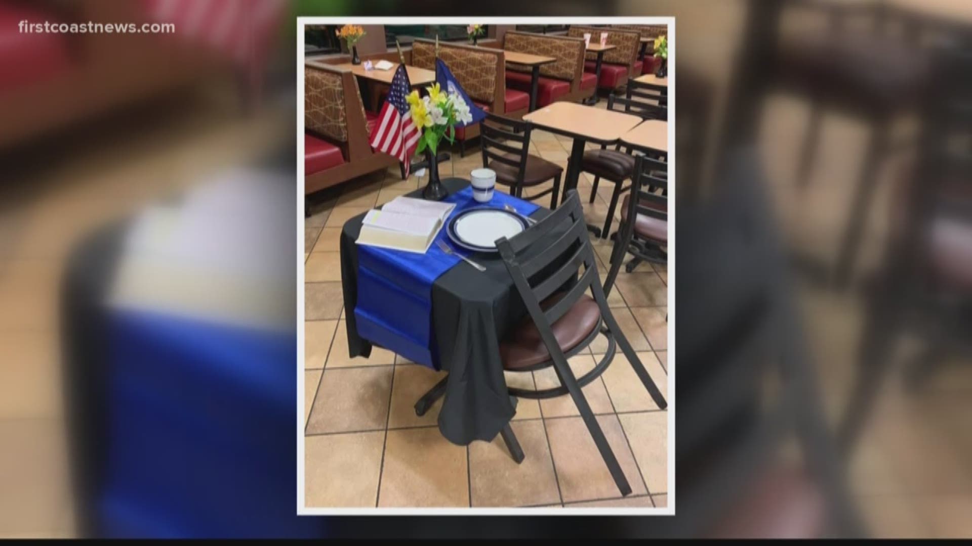 An American flag, a Bible, and a place setting with a blue tablecloth was laid out on a table at the Chick-fil-A in Yulee on Friday.