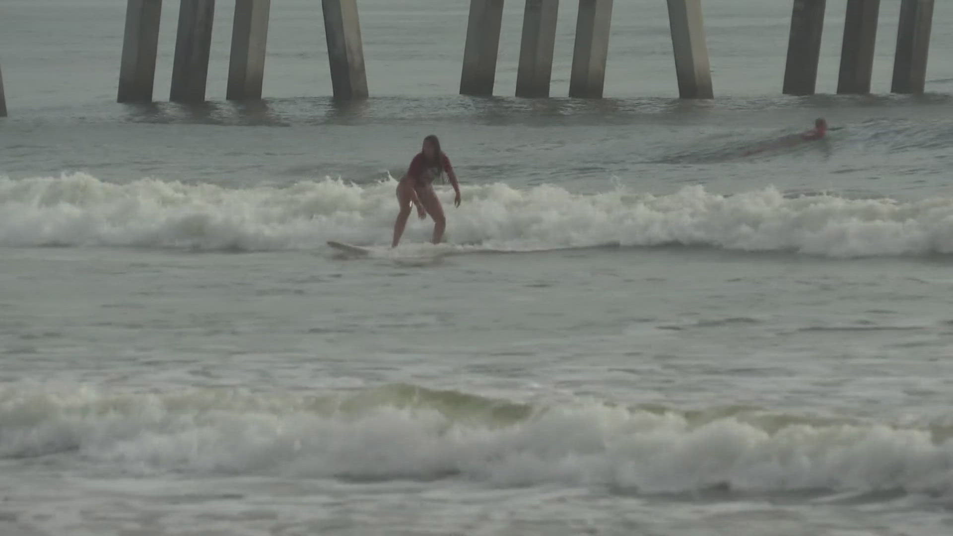 For young girls watching on the sand, they get to see just how talented female surfers are.