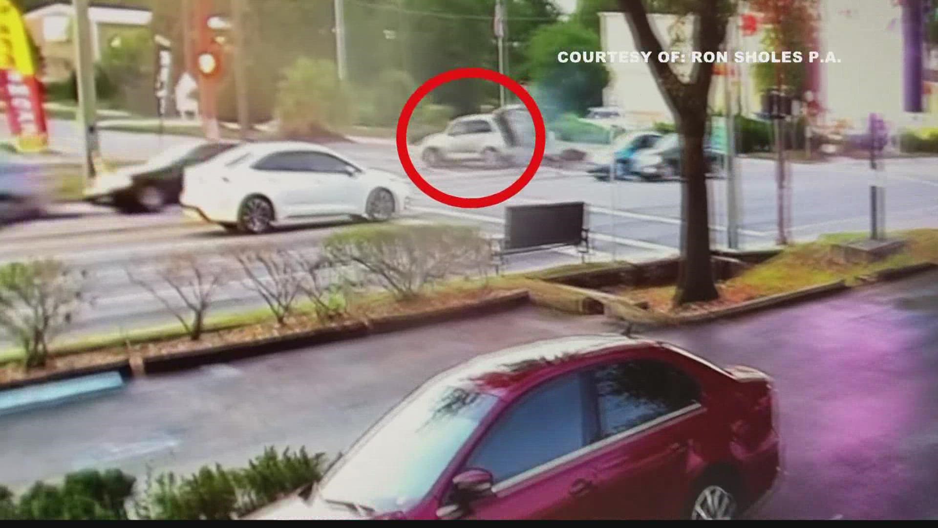 New video obtained by First Coast News shows a PT Cruiser making a sharp turn and wrecking into a curb.