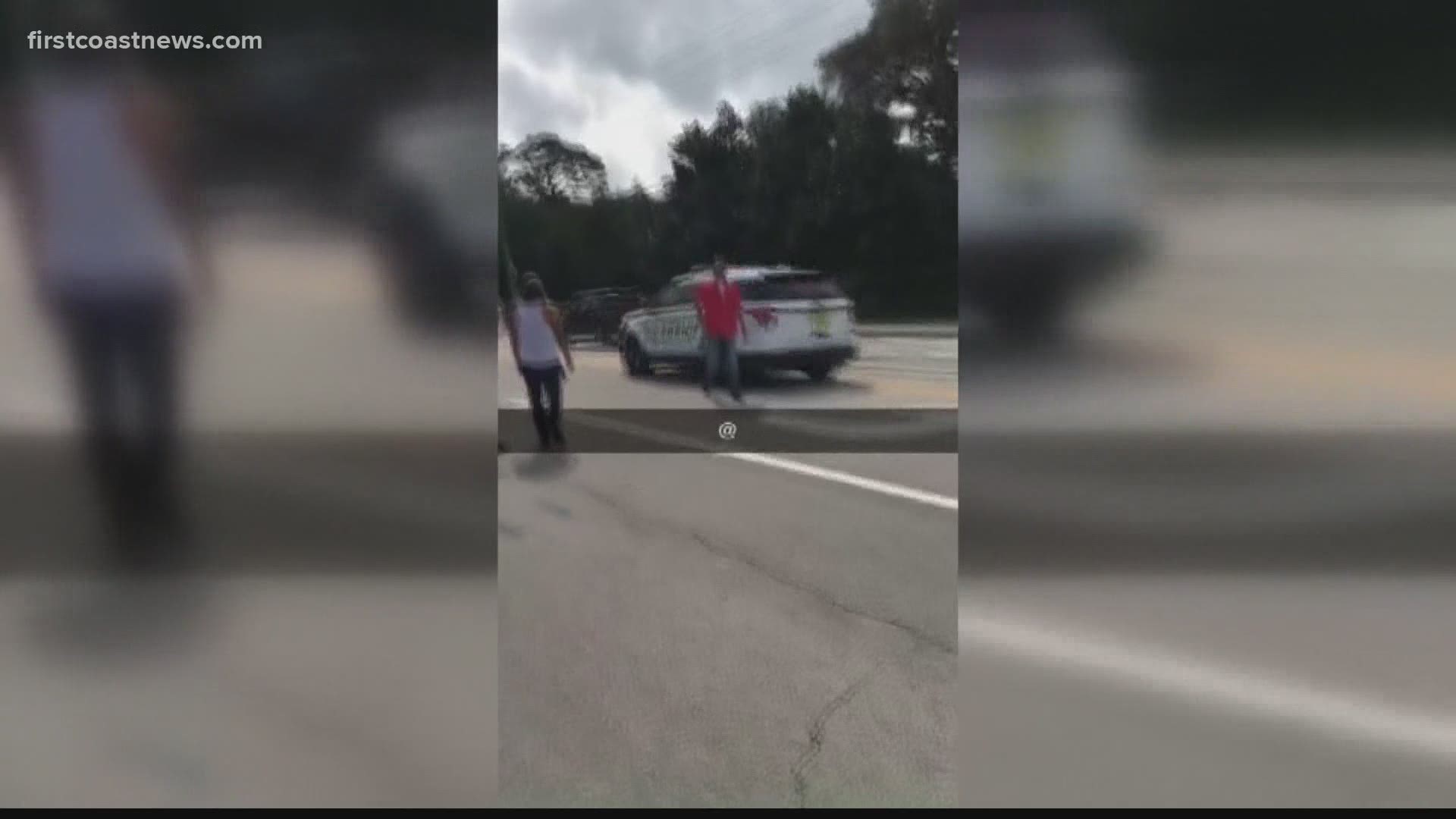 In a video posted to social media, pickups revved their engines and several yelled at deputies just feet from the cemetery.