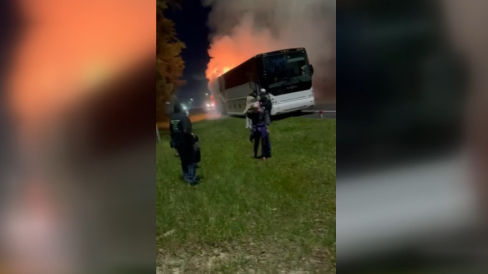 The bus caught on fire along Interstate 10 in Baker County Friday morning, as a passenger tells First Coast News a rear tire blew out and a spark caused the fire.