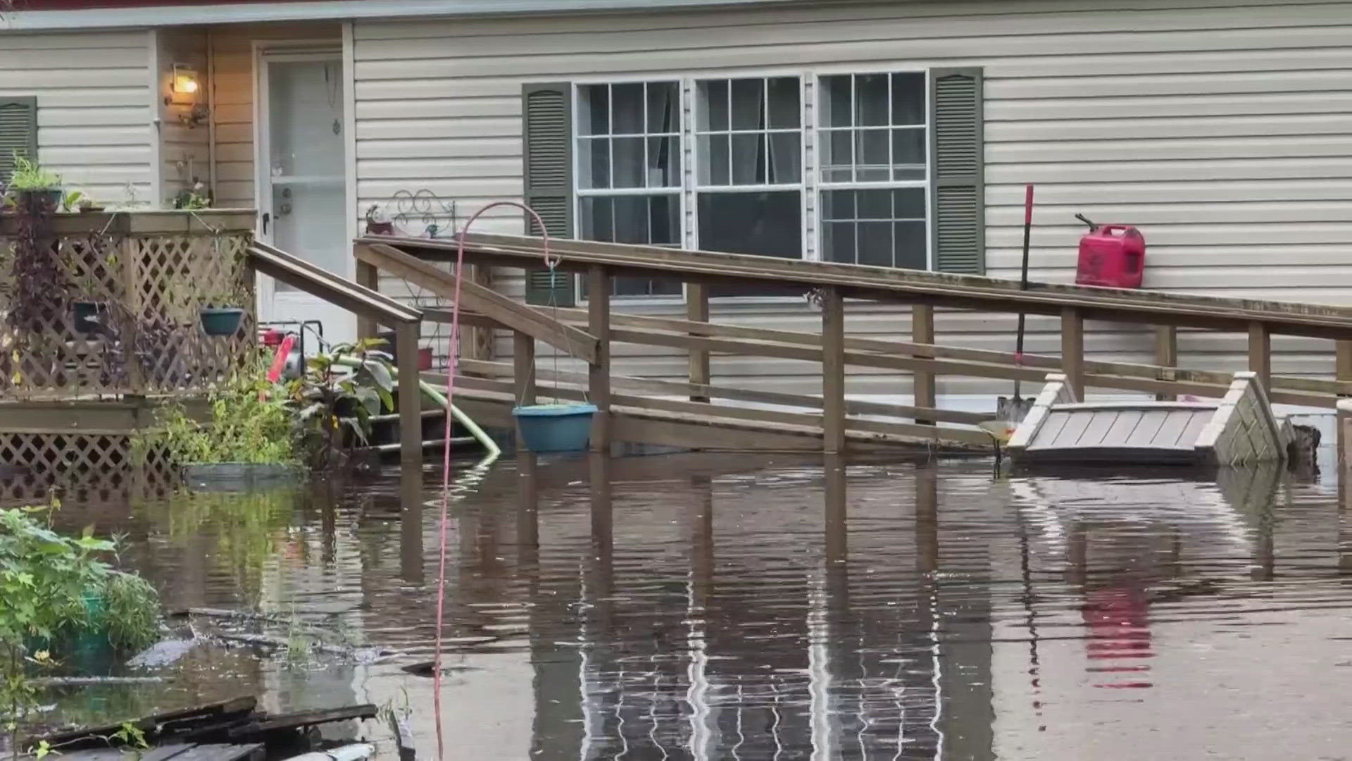 The family says the water gets as high as above their waist and near their chest in the backyard.