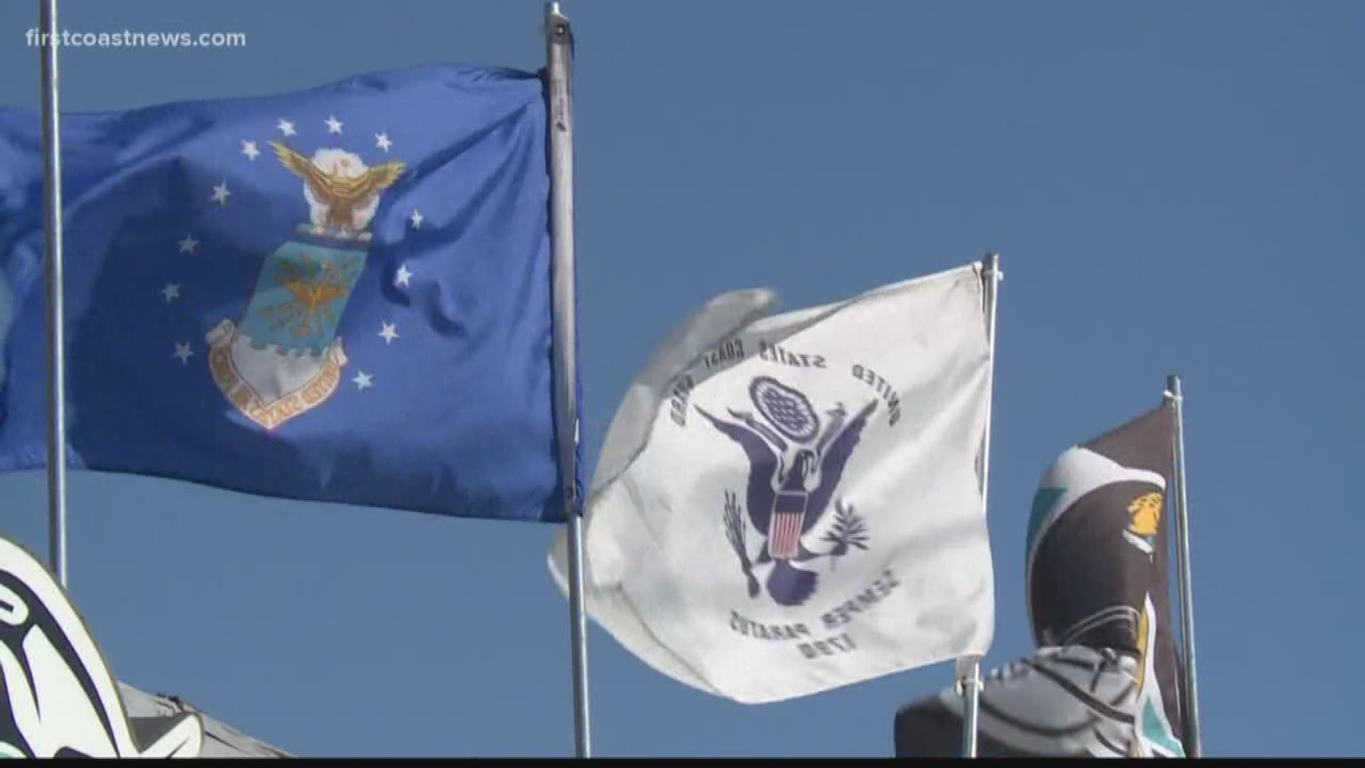 A Jacksonville City employee and her supervisor have been placed on administrative leave after citing a local business for flying military flags.