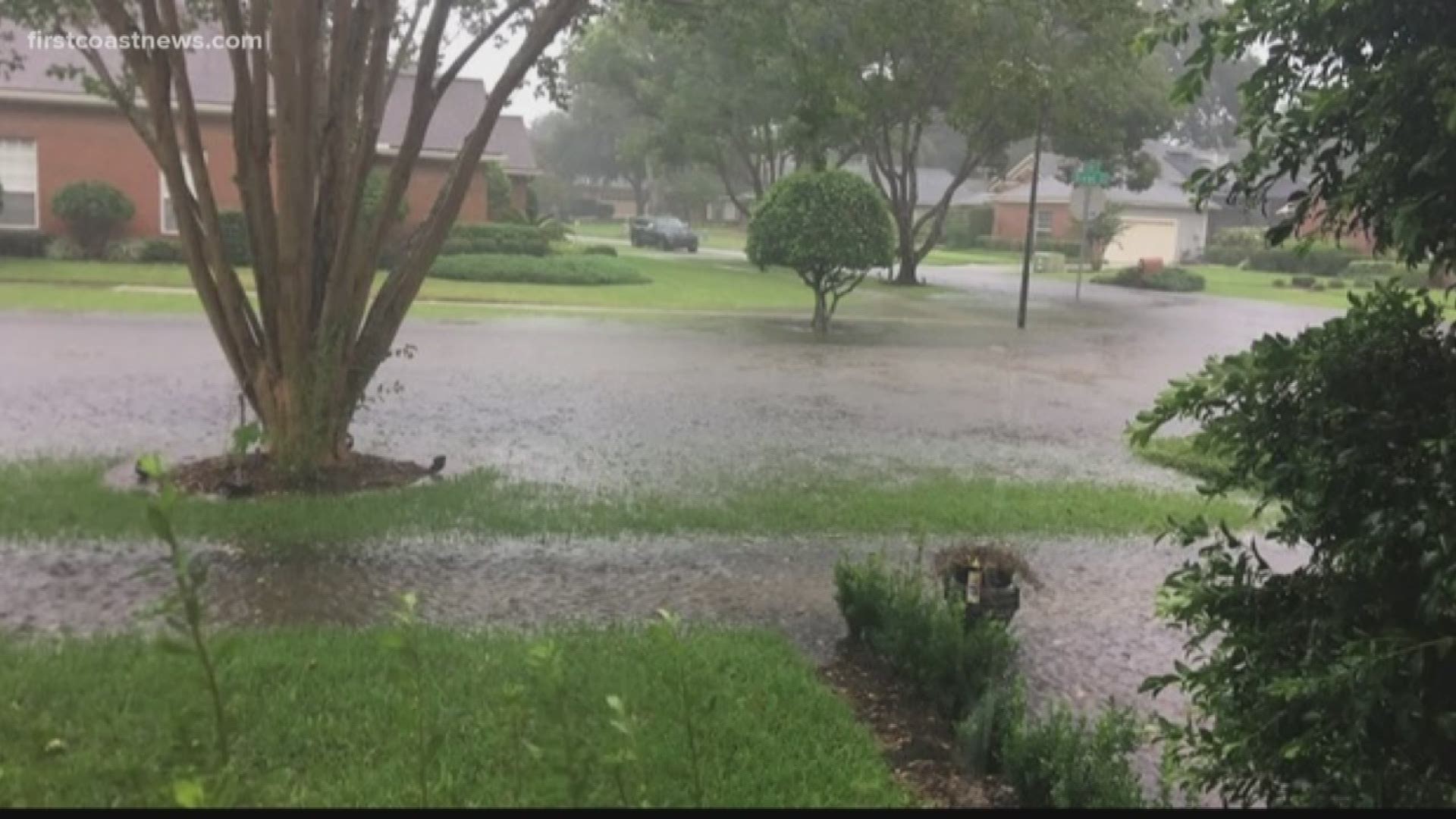 A Florida afternoon thunderstorm turns several streets in the Barrington Oaks subdivision into a flood zone.