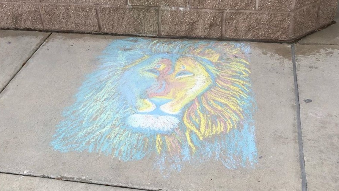 Staff uses sidewalk chalk to patients at St. Vincent's Urgent