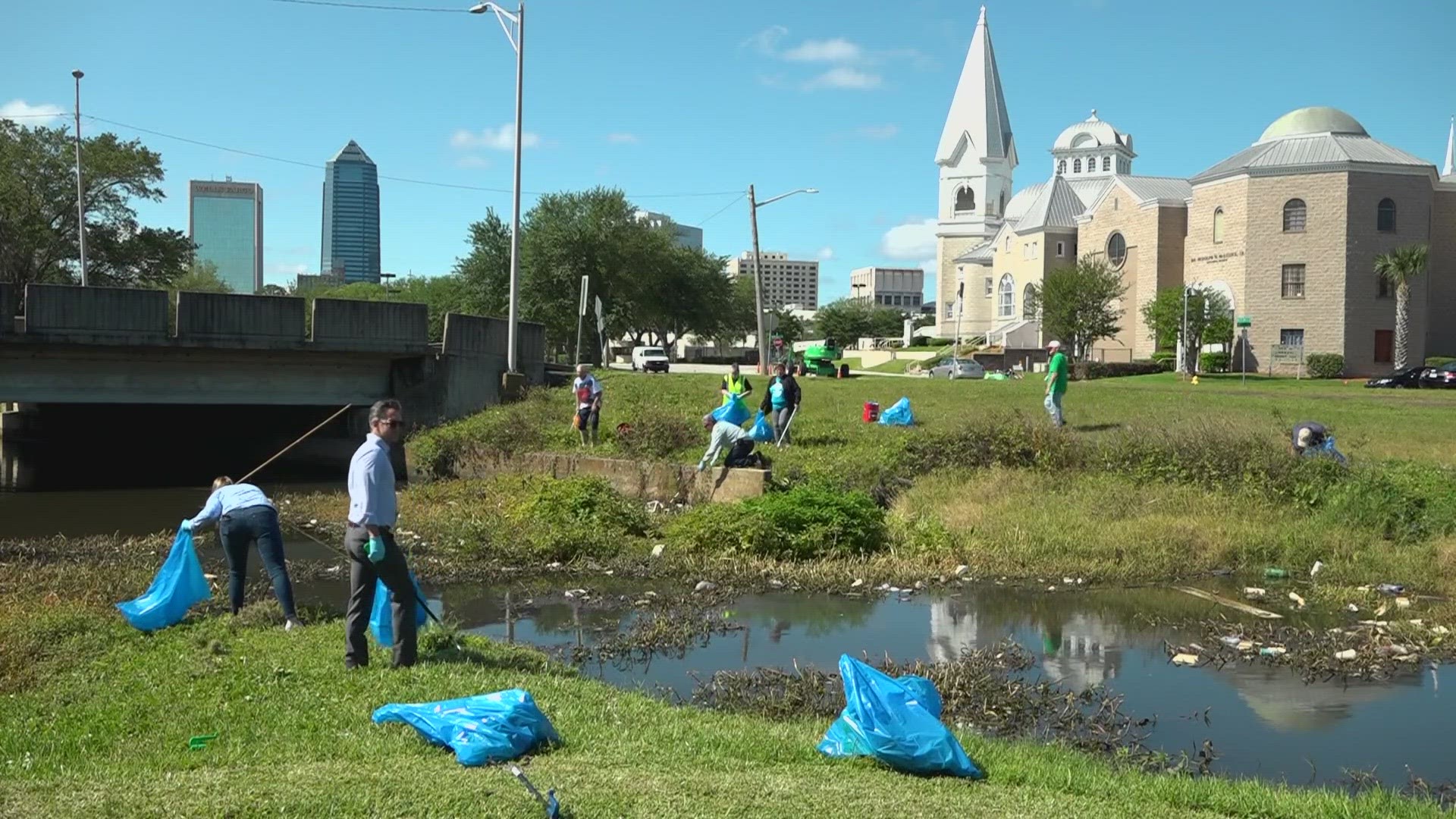 City leaders including Mayor Donna Deegan got their hands dirty while cleaning up trash in the Hogans Creek area.