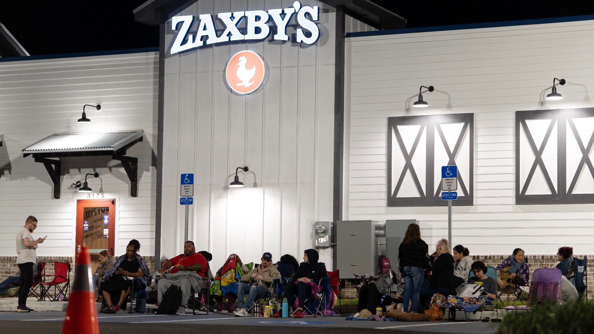 Dozens wait outside new Zaxby's in Jacksonville for chance to get free