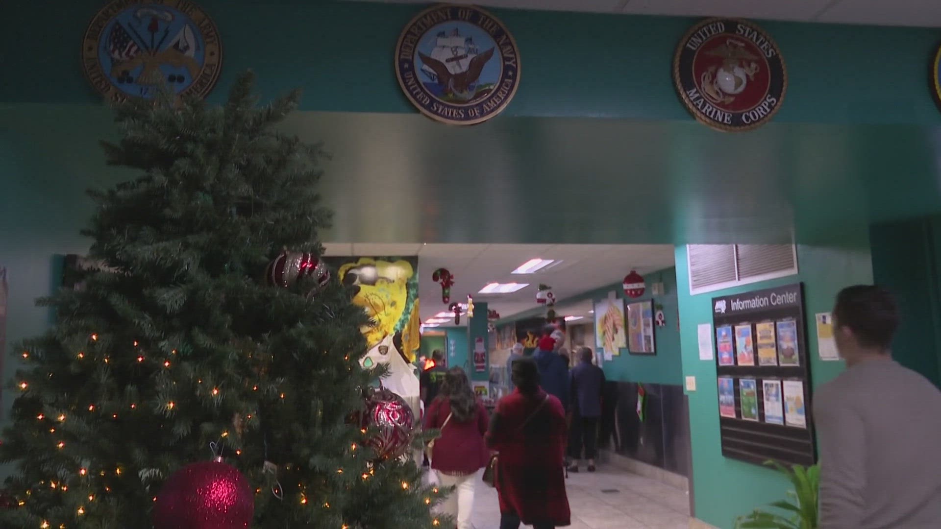 The commanding officer at Mayport served a Christmas meal with his family and neighbors to family members of sailors stationed at Naval Station Mayport.