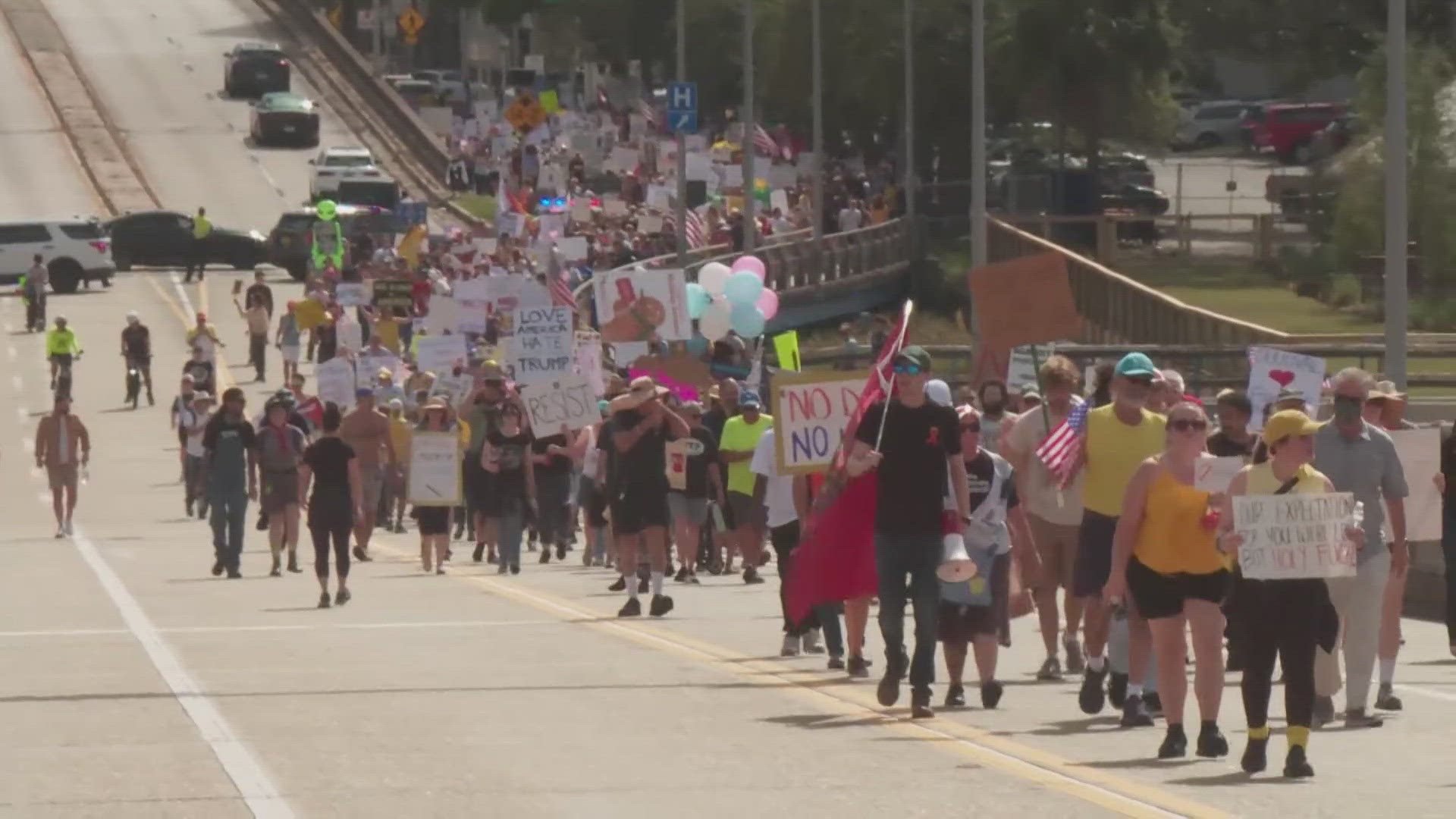 Thousands filled Jacksonville's downtown streets Saturday, many dressed in blow-up costumes, to take part in a "No Kings" protest.