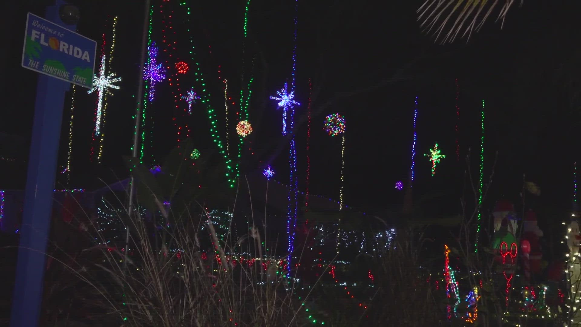 People line up for hours to see the lights on Girvin Road. Casey Jones and his son hung 50,000 lights, and they hope they will hang on.