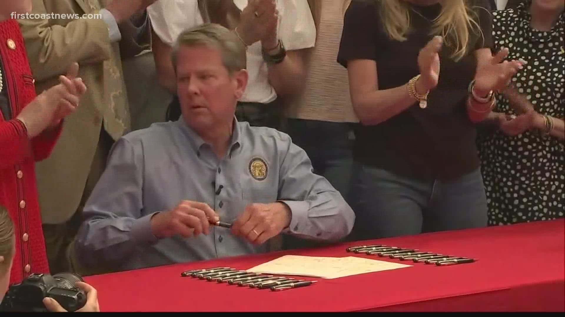 Gov. Brian Kemp signed two bills on Tuesday that eliminated the requirement for a gun permit in Georgia and allows people out of state to carry a firearm in Georgia