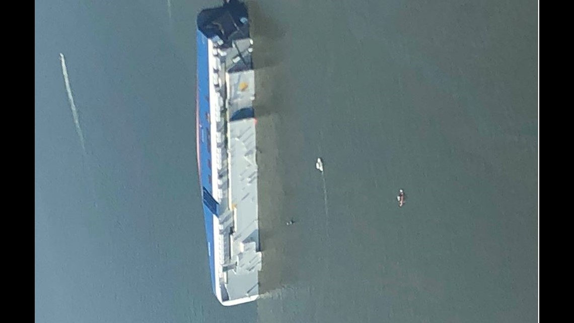 PHOTOS Aerial view of overturned cargo ship leaking fluid into the St