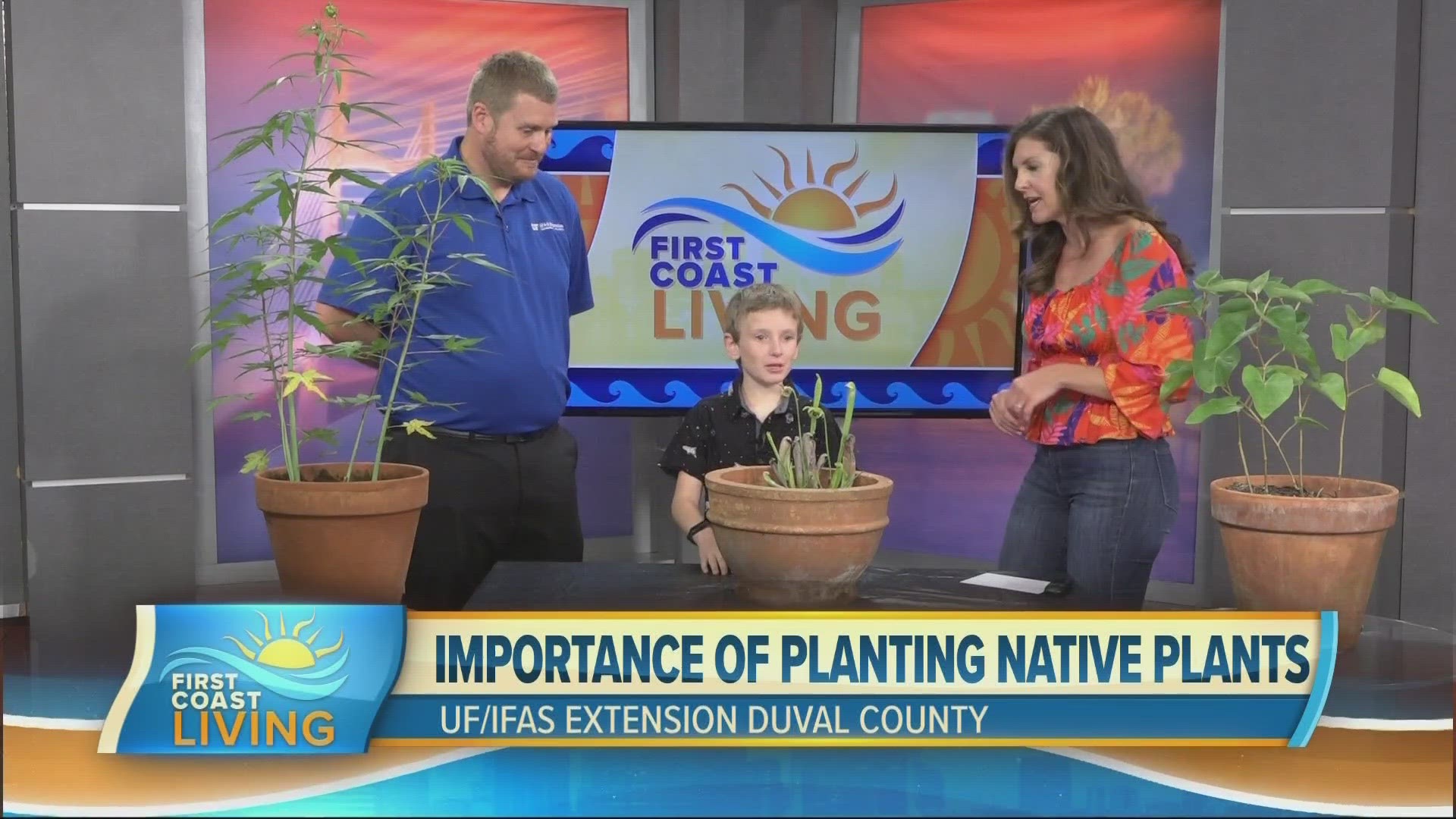 Stephen Jennewein with UF/IFAS Extension Duval County, and his son Thomas, show off some Florida native plants.
