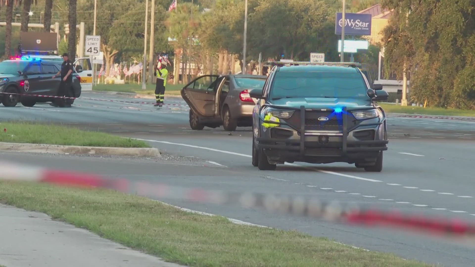 Officials say the incident happened shortly after the man drove through a red light and crashed into a car with a woman and her two kids inside.