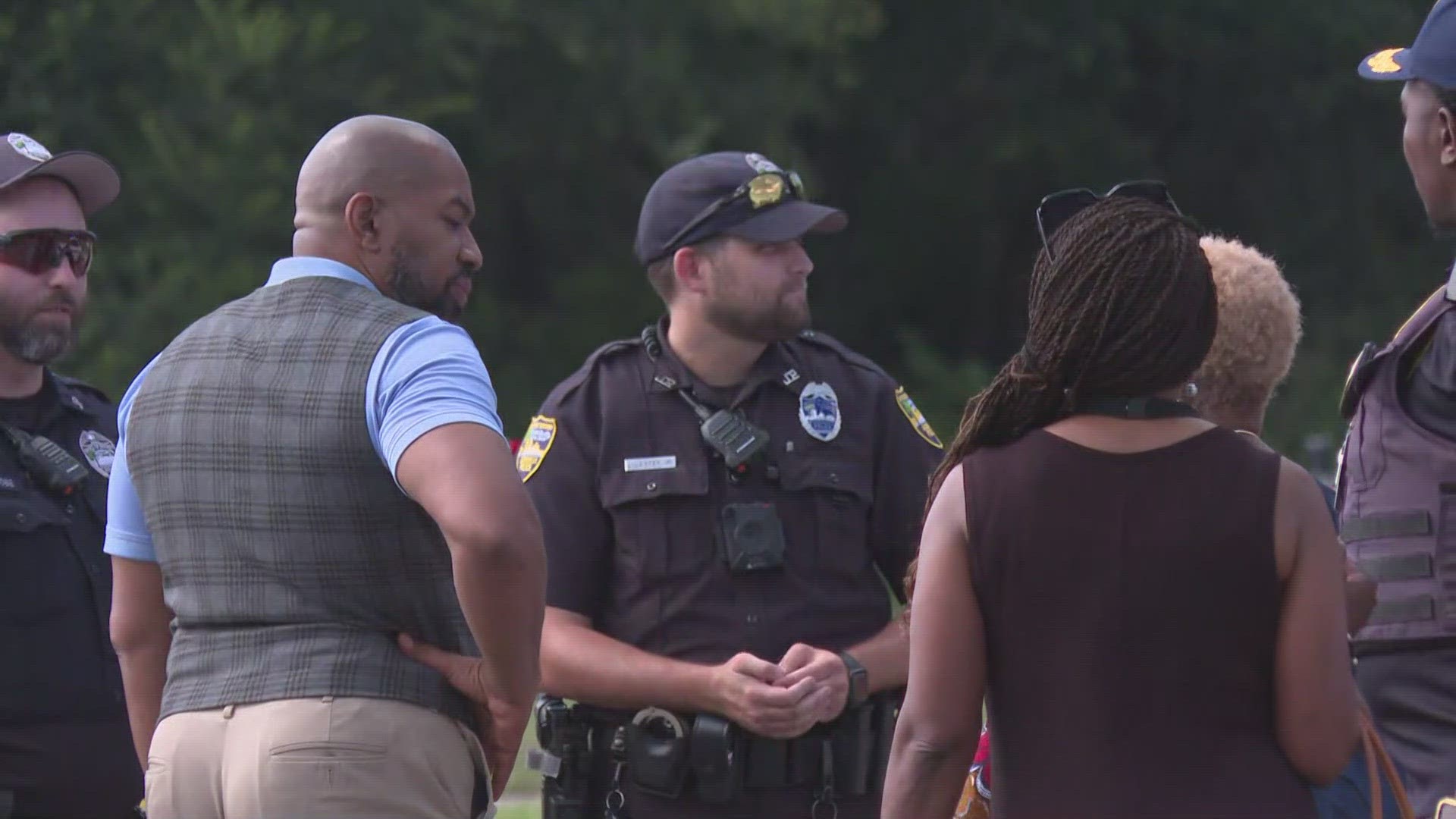 A community prayer was held in the middle of the street after the shooting.