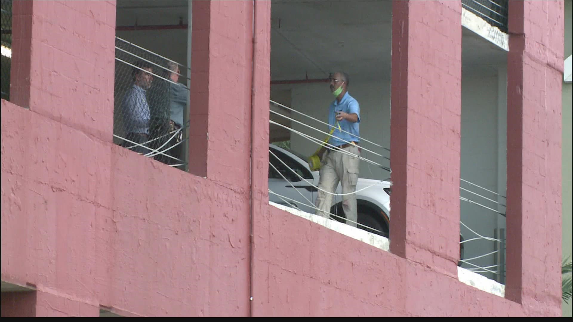 Workers at the Peninsula of Jacksonville Condominiums work to repair the damage.