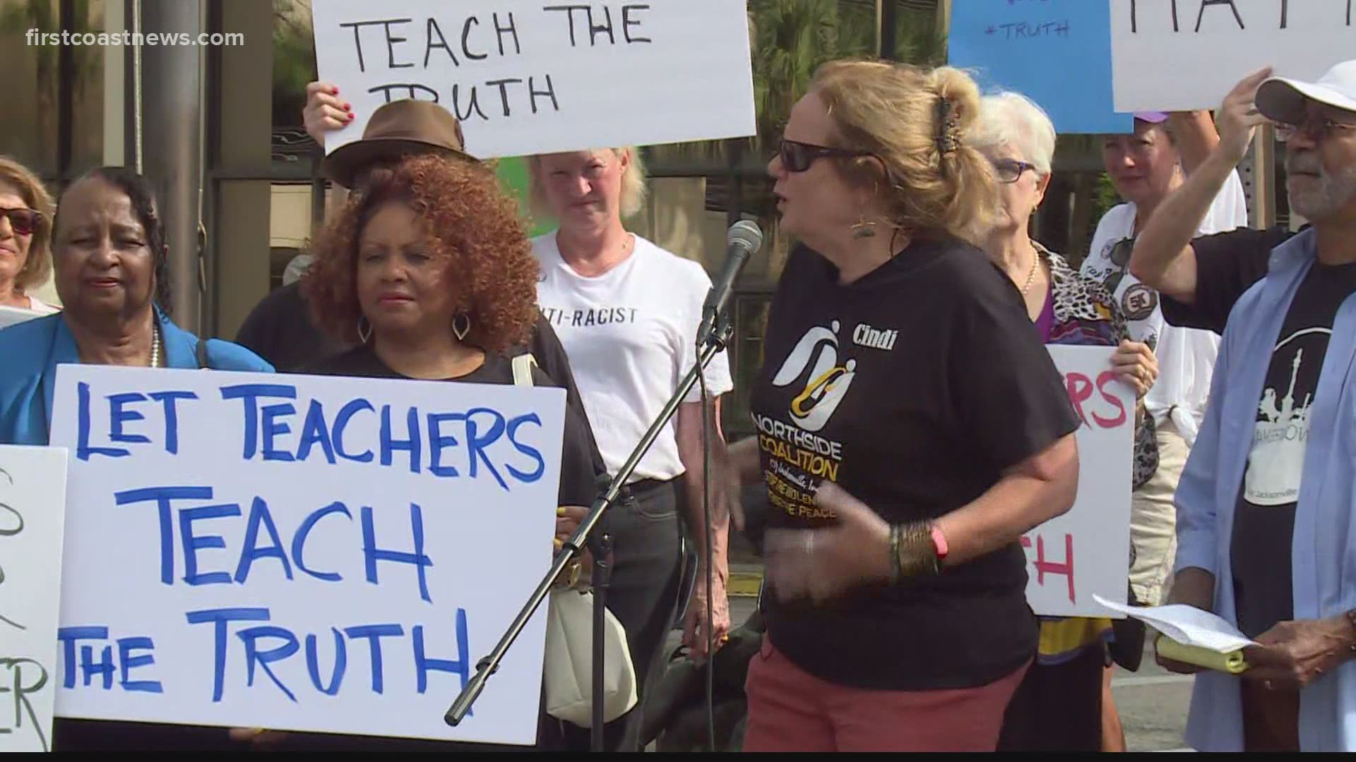 The Northside Coalition along with other activists are speaking outside the Duval County School District office on Friday.