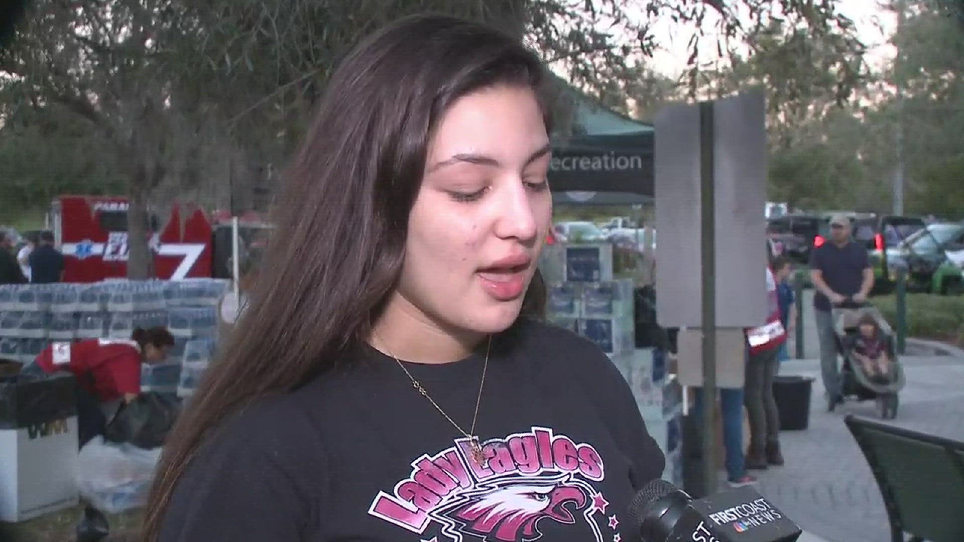 A Stonman Douglas student describes her grieve during a vigil in Parkland. She left school hours before a shooting their in which 17 people were killed.