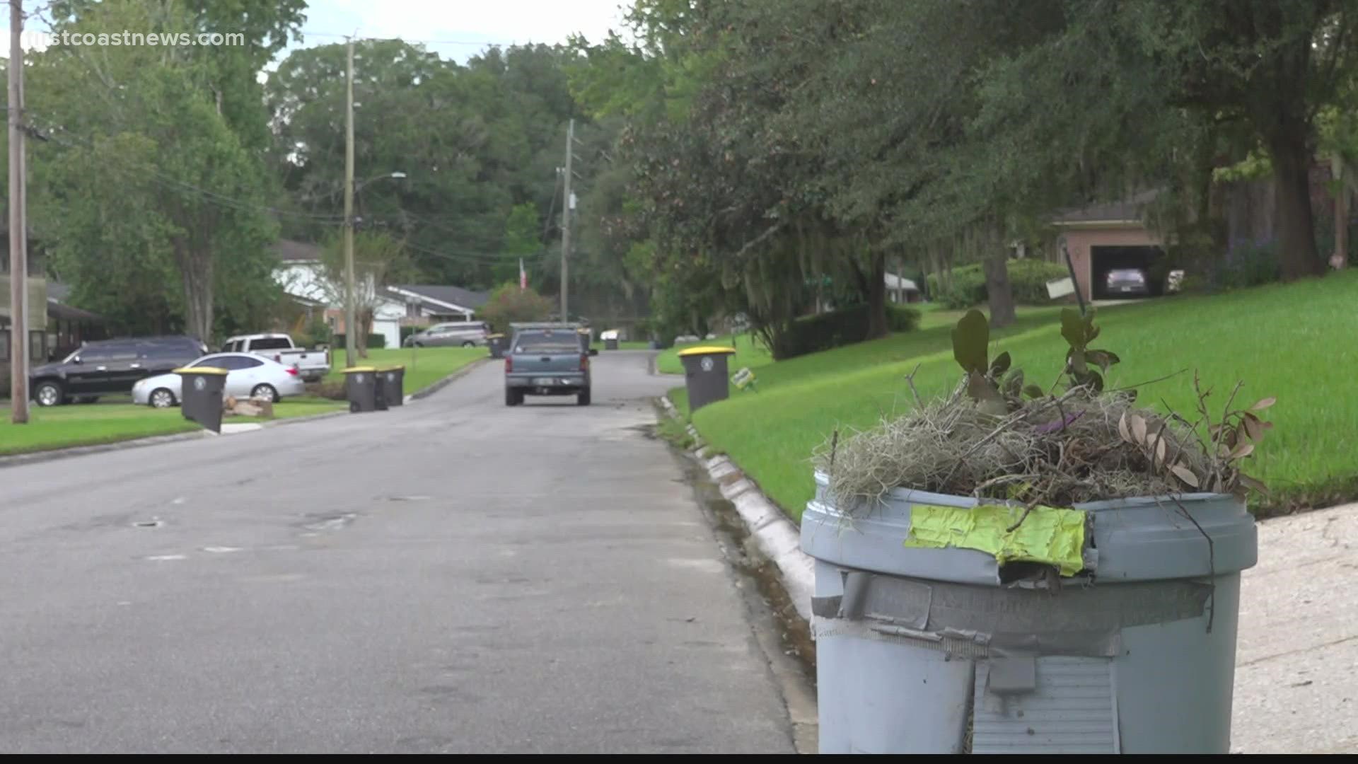 People who live in the area say household garbage has been picked up, but their yard waste and recycling haven't been picked up for a month.