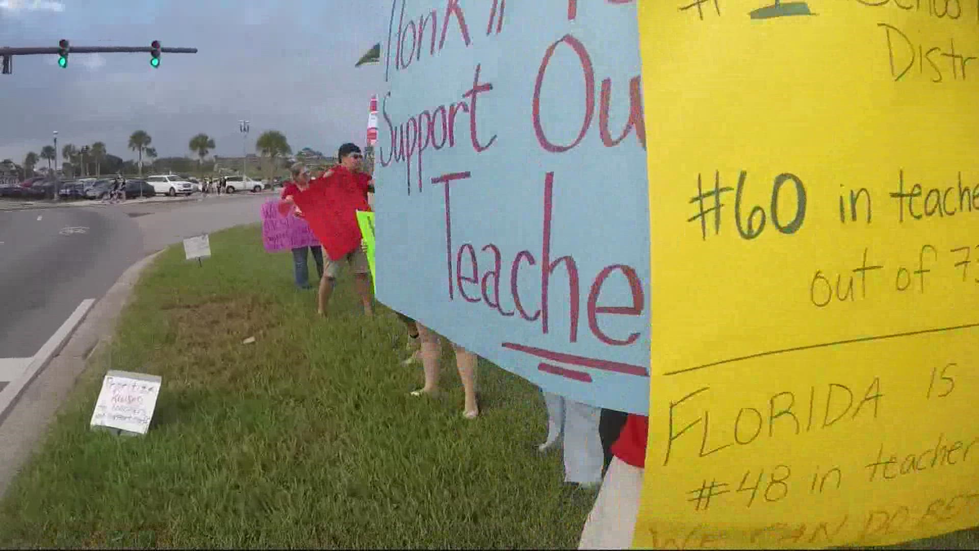 A couple dozen teachers gathered at the fort in St. Augustine to draw attention to the issue.