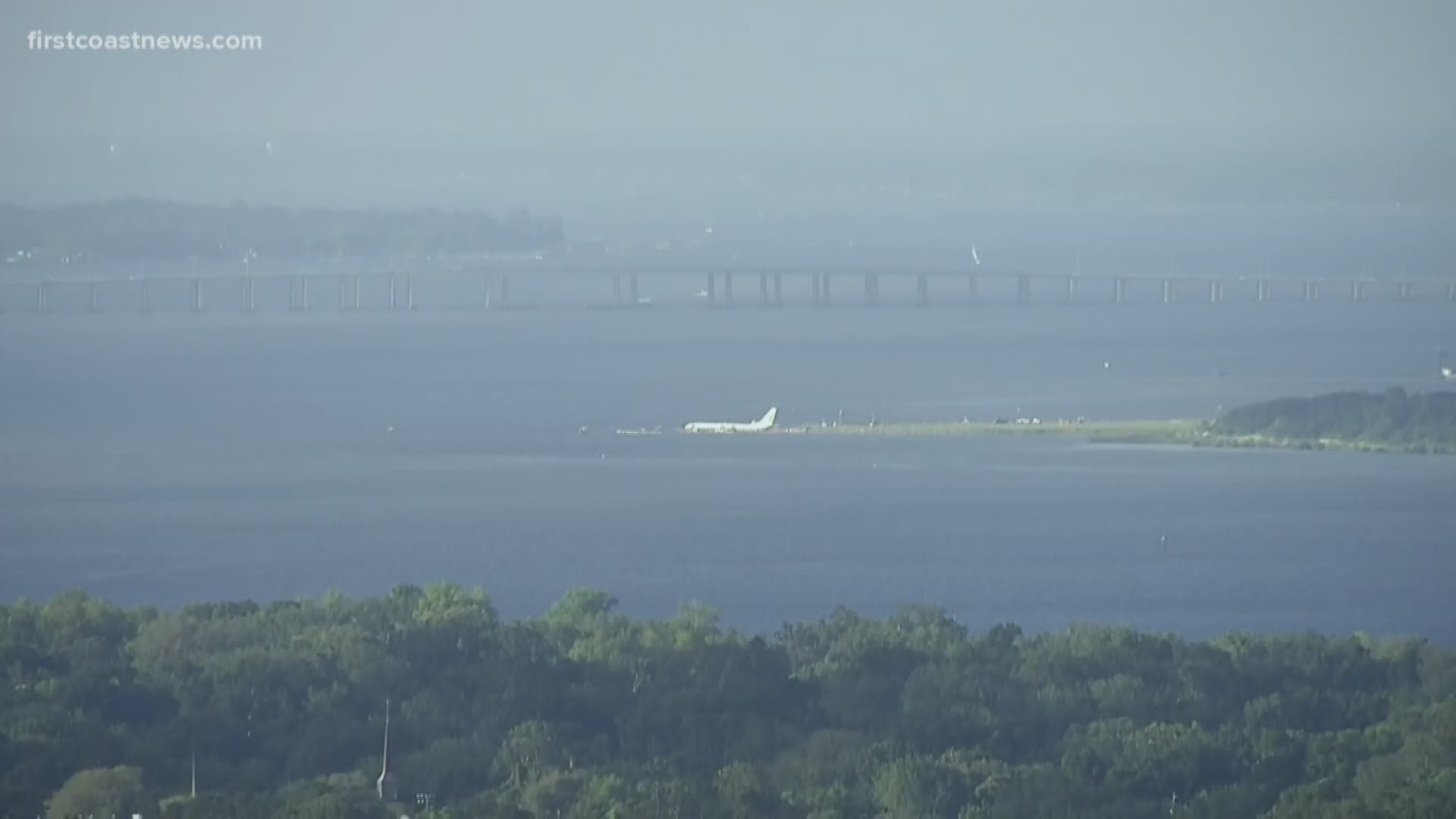 The Boeing 737-800 civilian aircraft was carrying 142 people when it skidded off the runway and into the St. Johns River near the NAS Jax airport Friday around 9:40 p.m. No serious injuries were reported.
