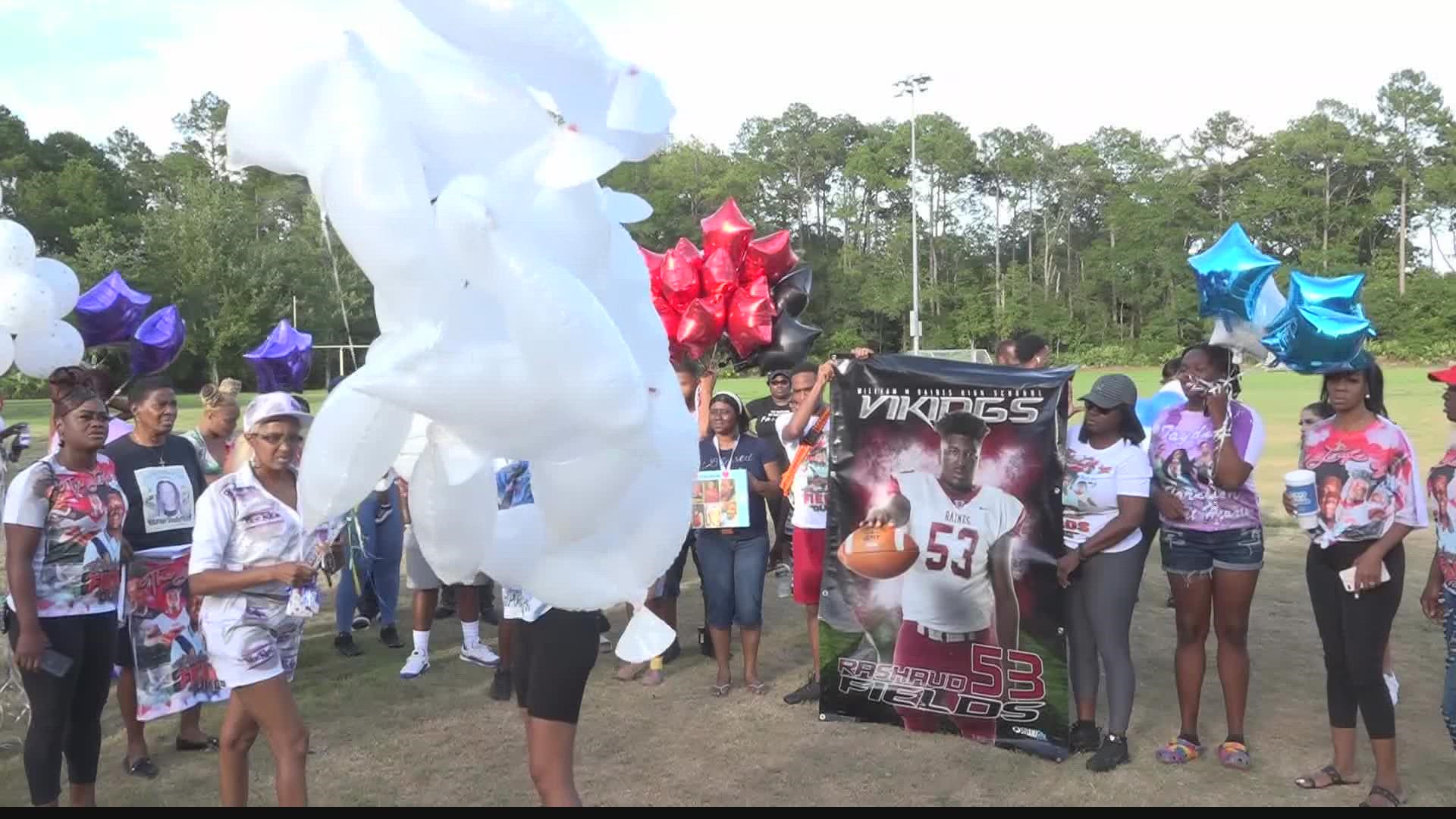 Families gathered around the football field at the Legends Center in Jacksonville on Saturday to honor their loved ones who were lost to gun violence.