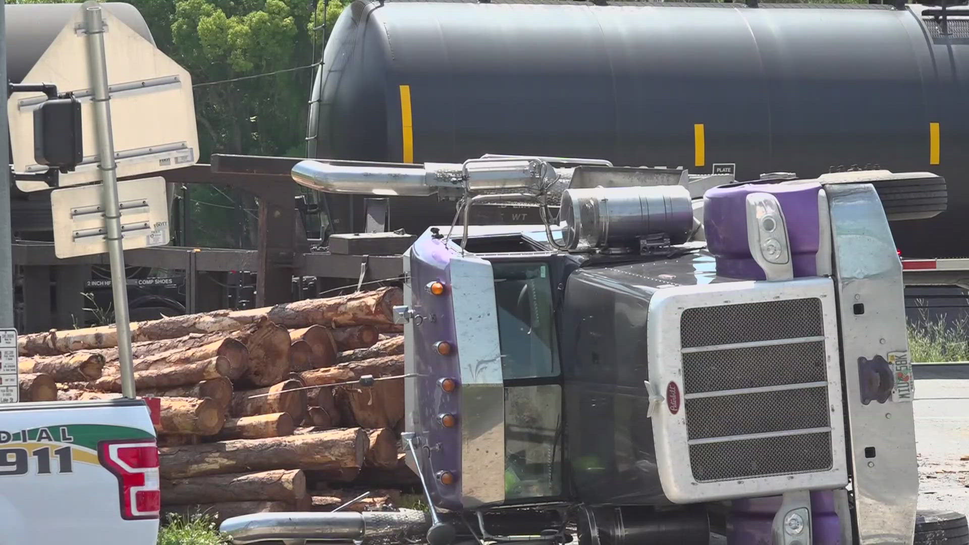 Officials with the Bradford County Sheriff office say the driver of the log truck had stopped for red light, but his trailer was too big, and the back end got stuck.