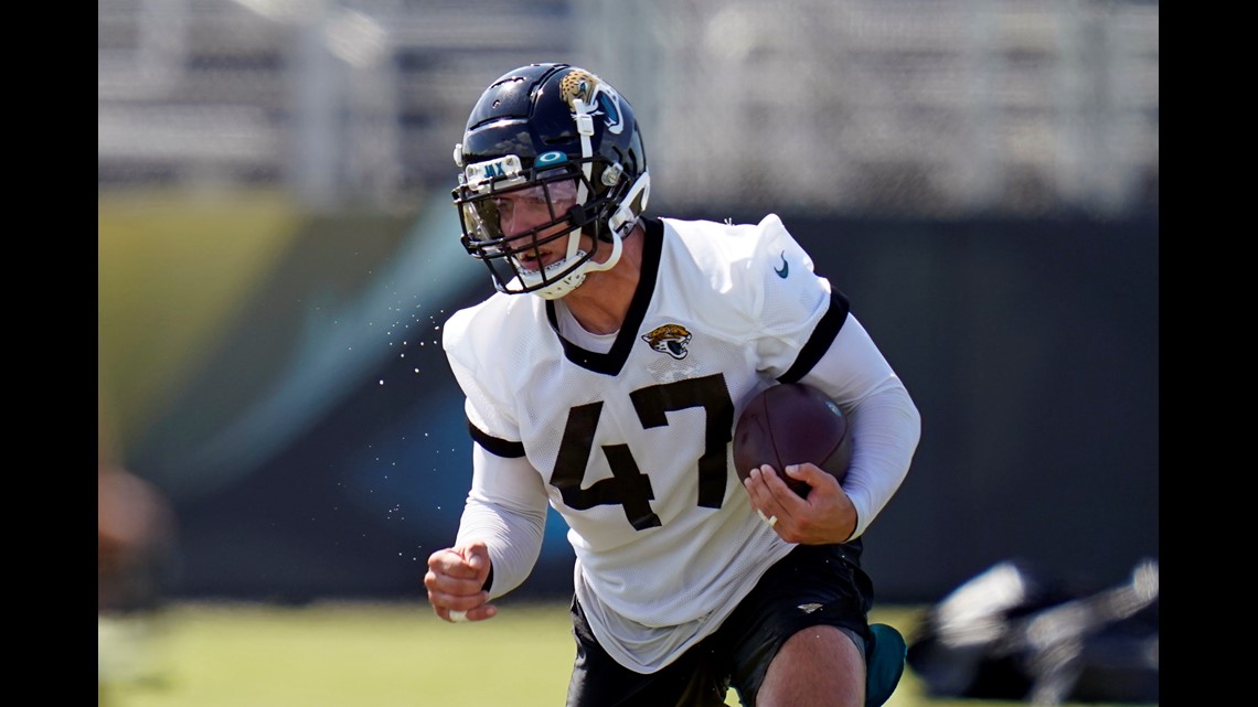 Jacksonville Jaguars K'Lavon Chaisson (45) performs a drill during