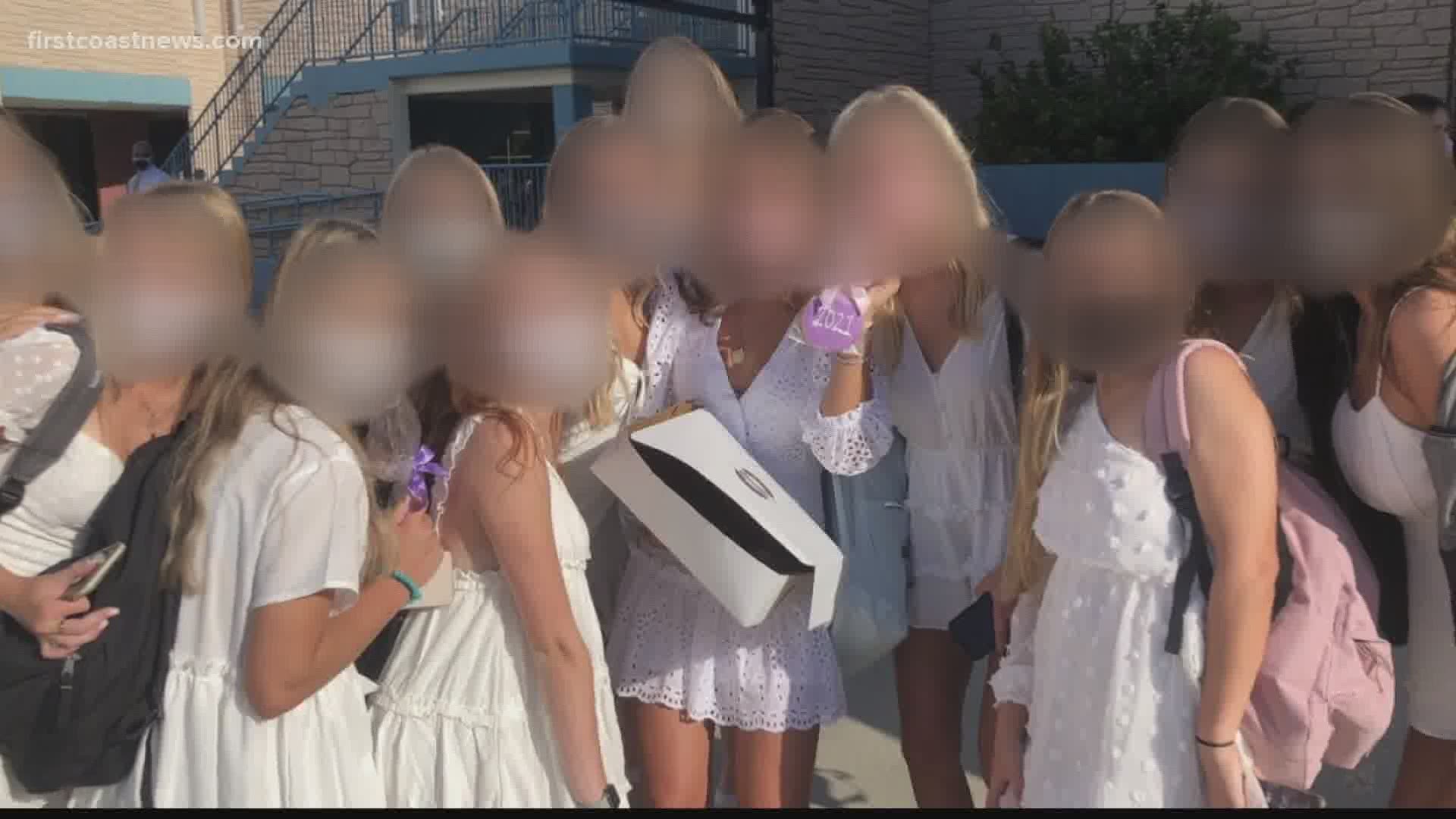 A traditional group photo the first day of classes at Ponte Vedra High School is being called careless by some parents, doctors and even the school district.