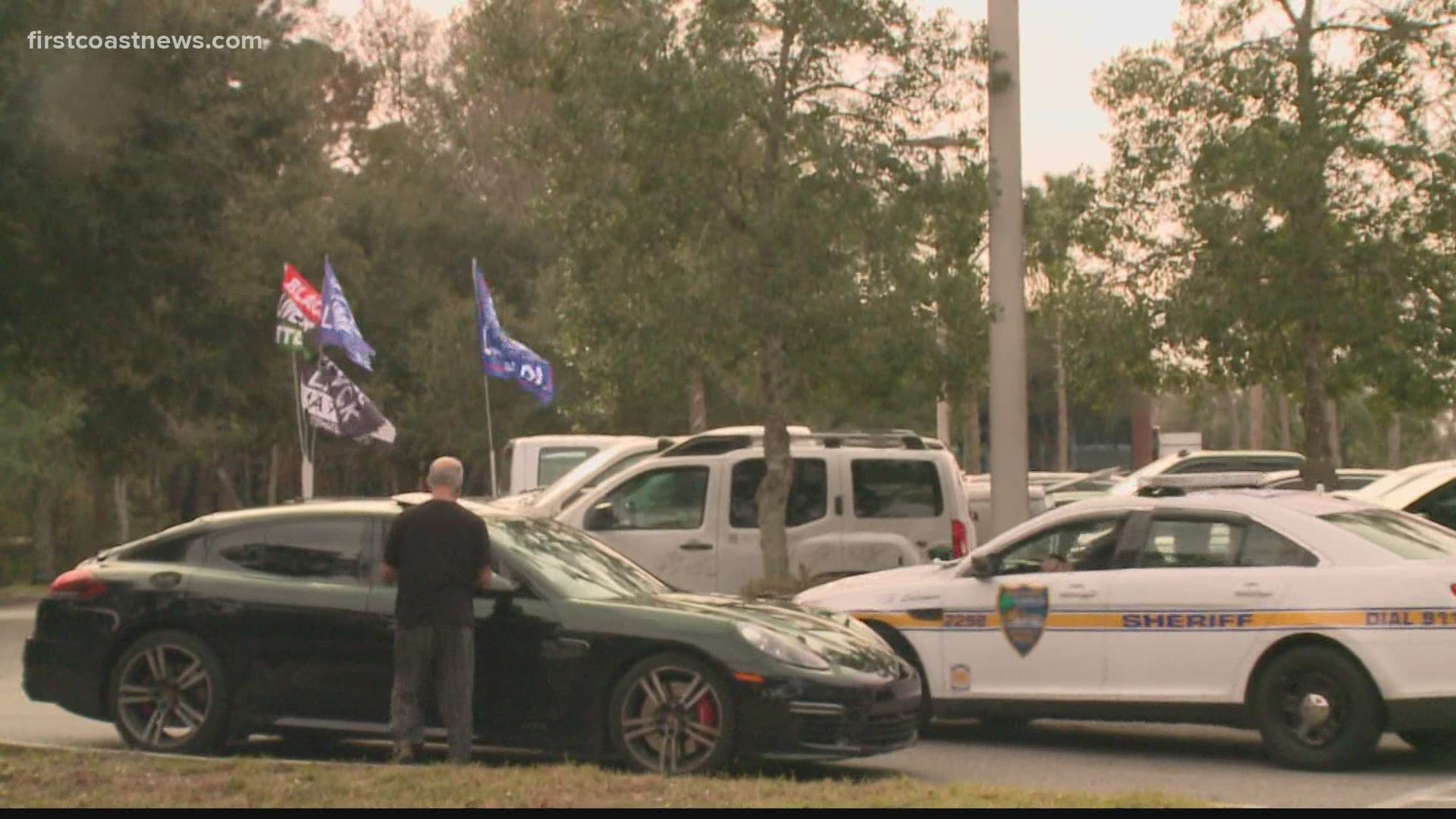 Protesters gather outside Congressman John Rutherford's Jacksonville office