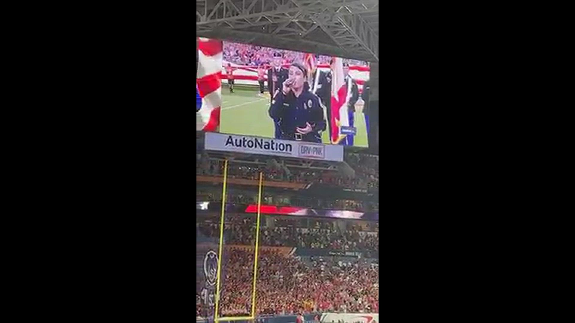 Sgt. Liz Bremer sings National Anthem in Florida. (Credit: Miami Police Department via Facebook)