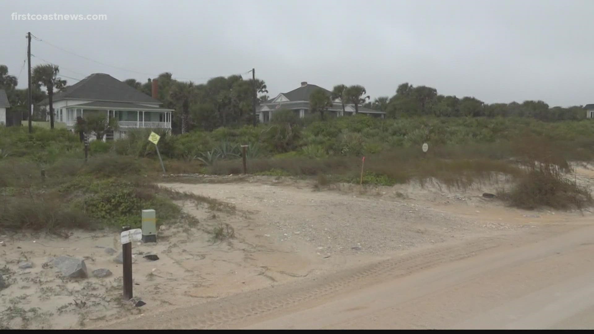 One commissioner proposed the county purchase homes to allow the beach to go back to its natural state, but the HOA is against the plan.