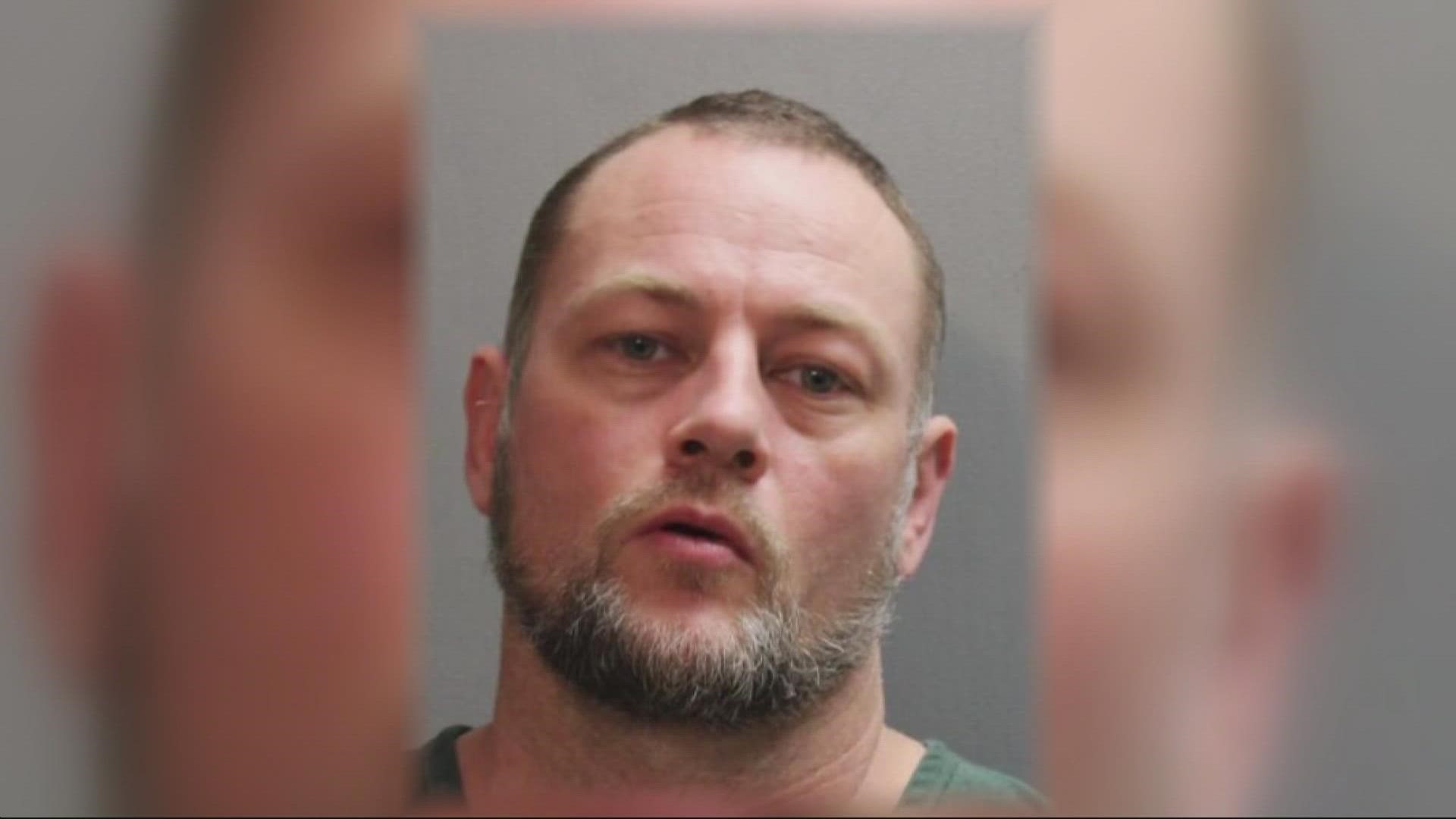 Eric S. Lackey, 44, was arrested on murder charges after police found a dead body. During his arrest, he pointed a gun at officers and was shot, police said.
